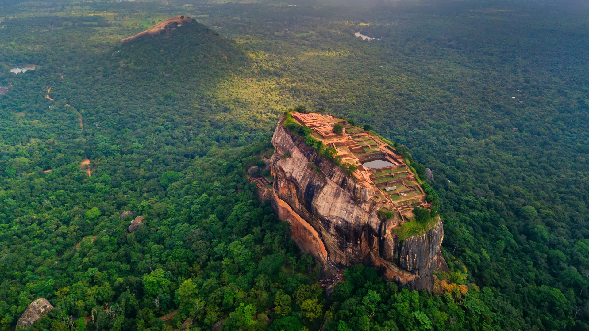 Aerial view of Sigiriya rock at misty morning, Matale District, Sri Lanka