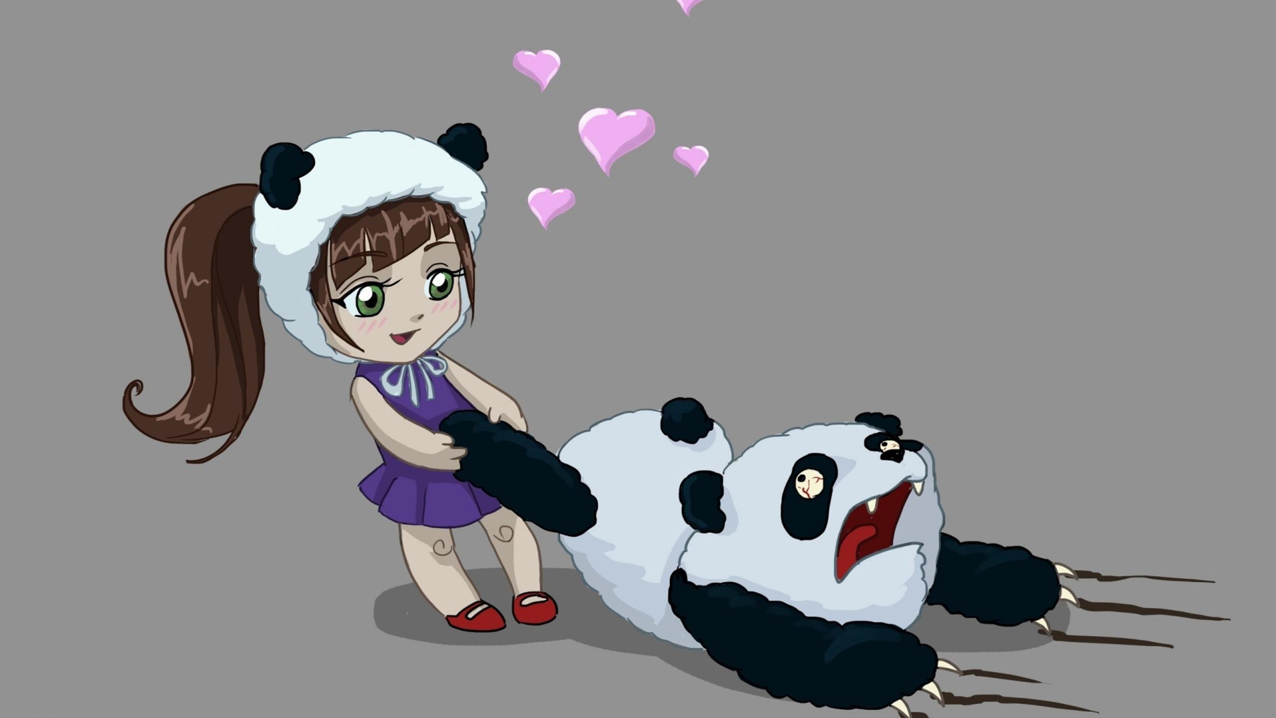 A little girl playing with a panda