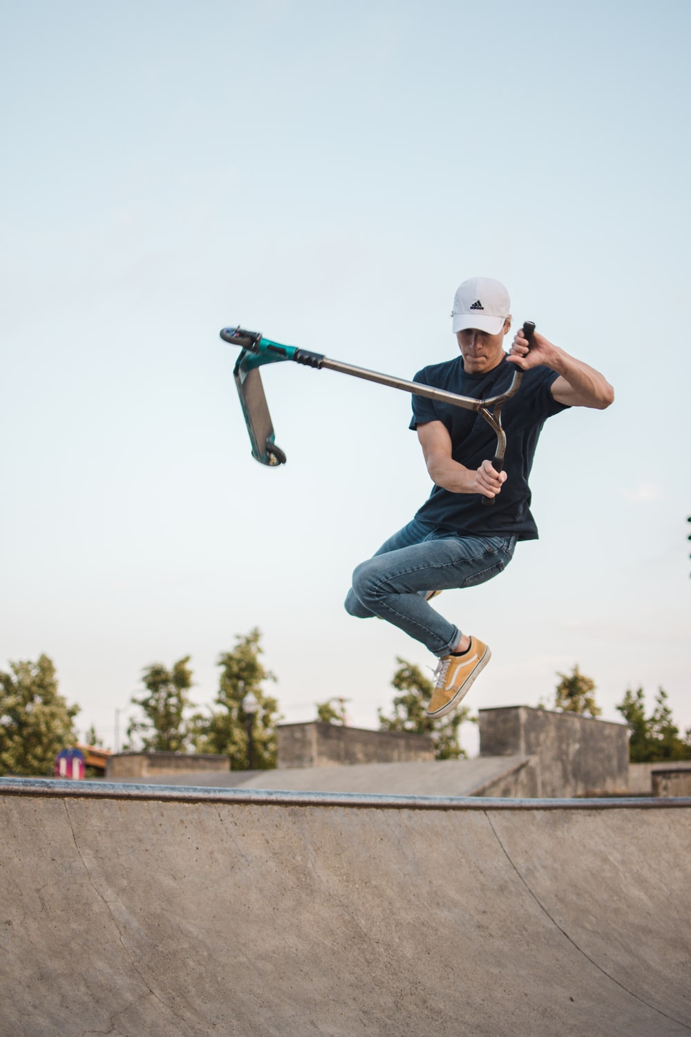 man playing kick scooter photo