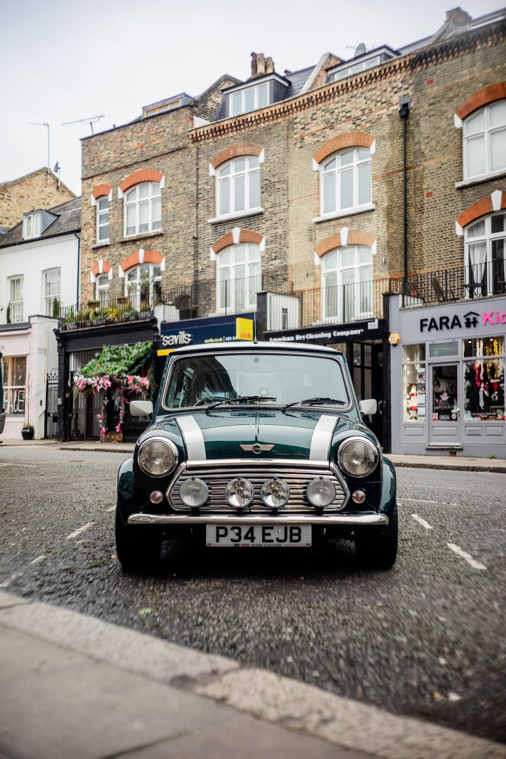 green Mini Cooper on road during daytime photo – Free Car Image