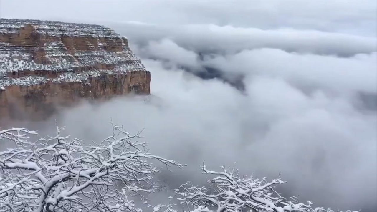 Clouds Fill Snow Dusted Grand Canyon