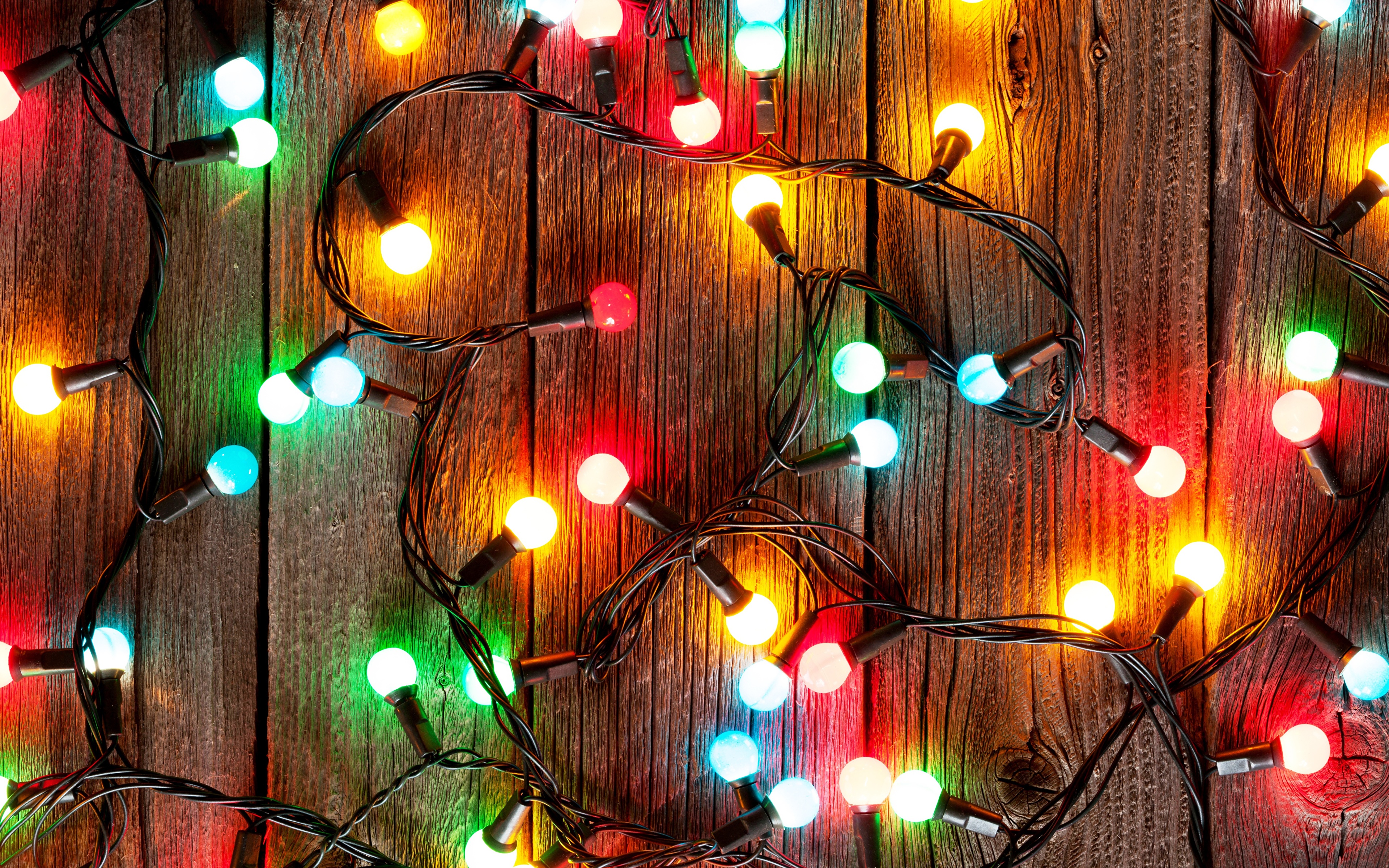 Photos Christmas Fairy lights Closeup Holidays Wood planks 3840x2400