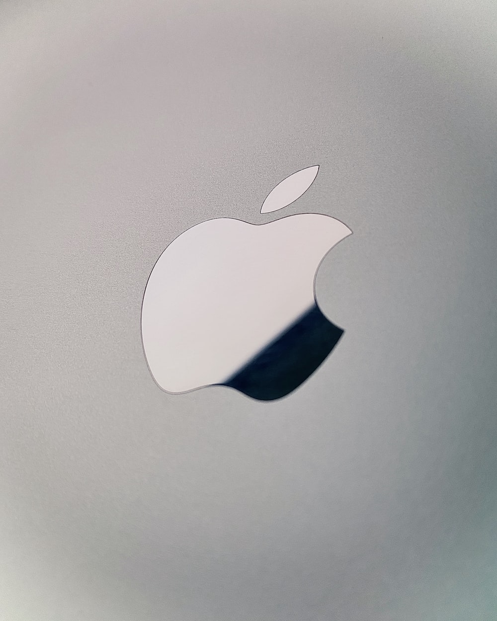 silver apple logo on silver surface photo