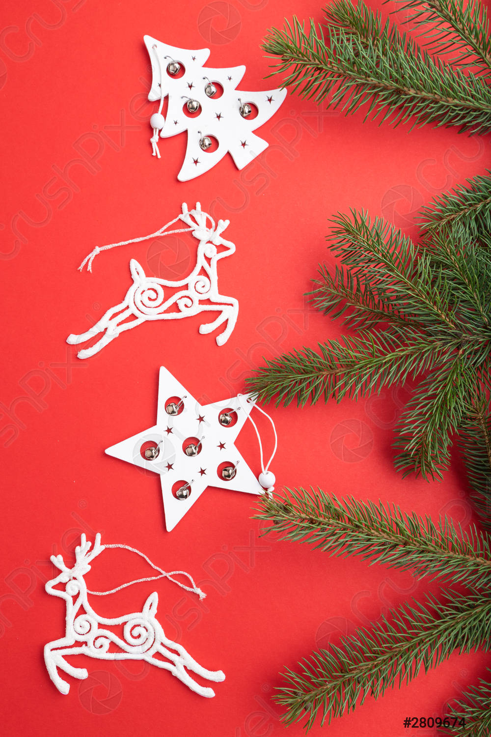 Christmas or New Year composition Decorations on a red pastel