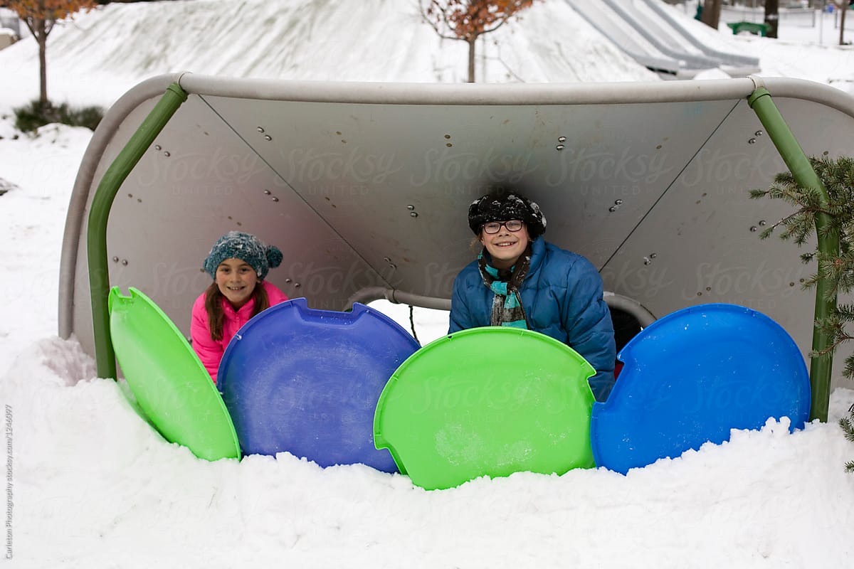 Building A Fort In Preparation Of A Snowball Fight On A Snow Day