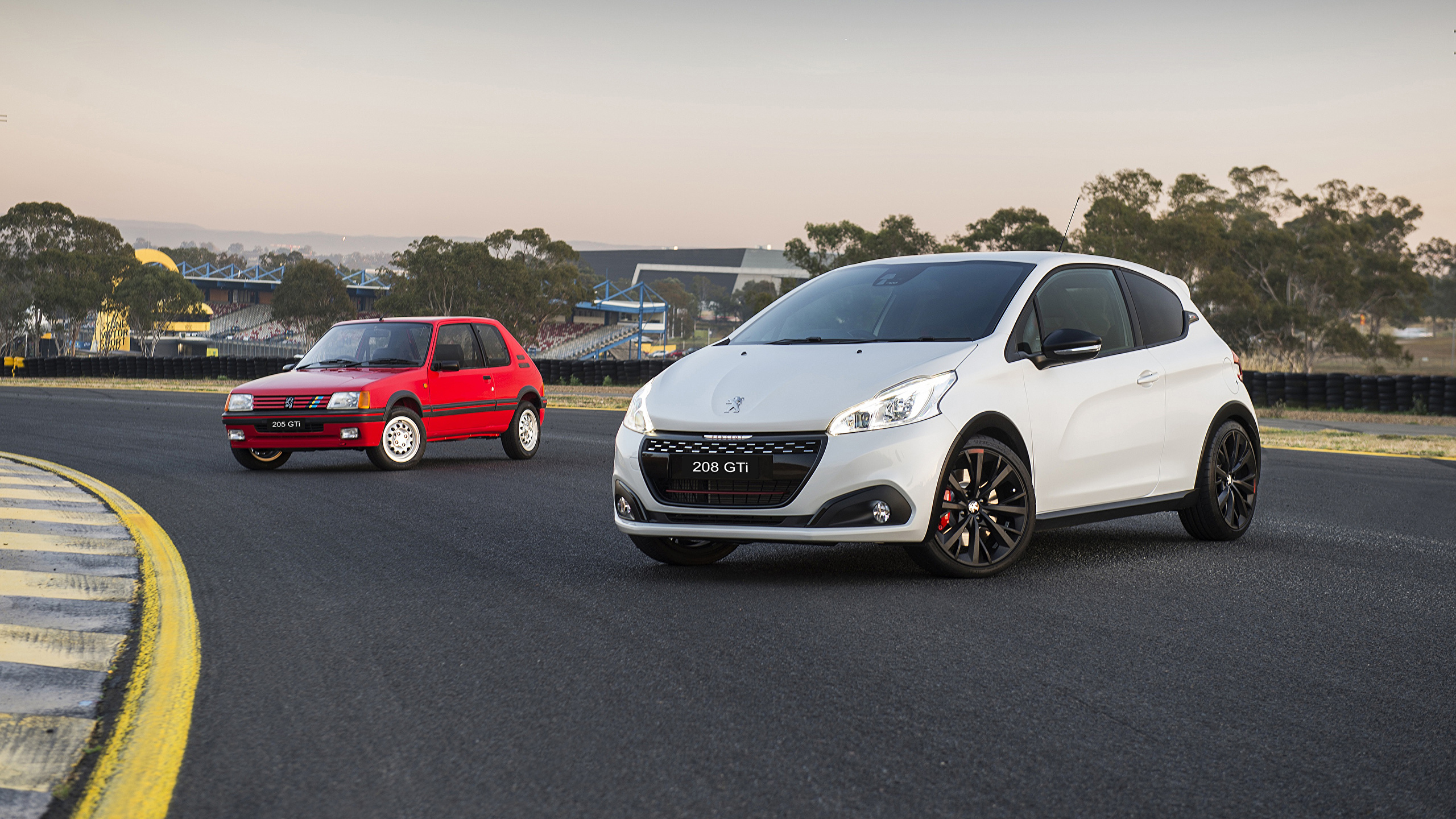 Wallpaper Peugeot 208 GTi Two Cars 2560x1440