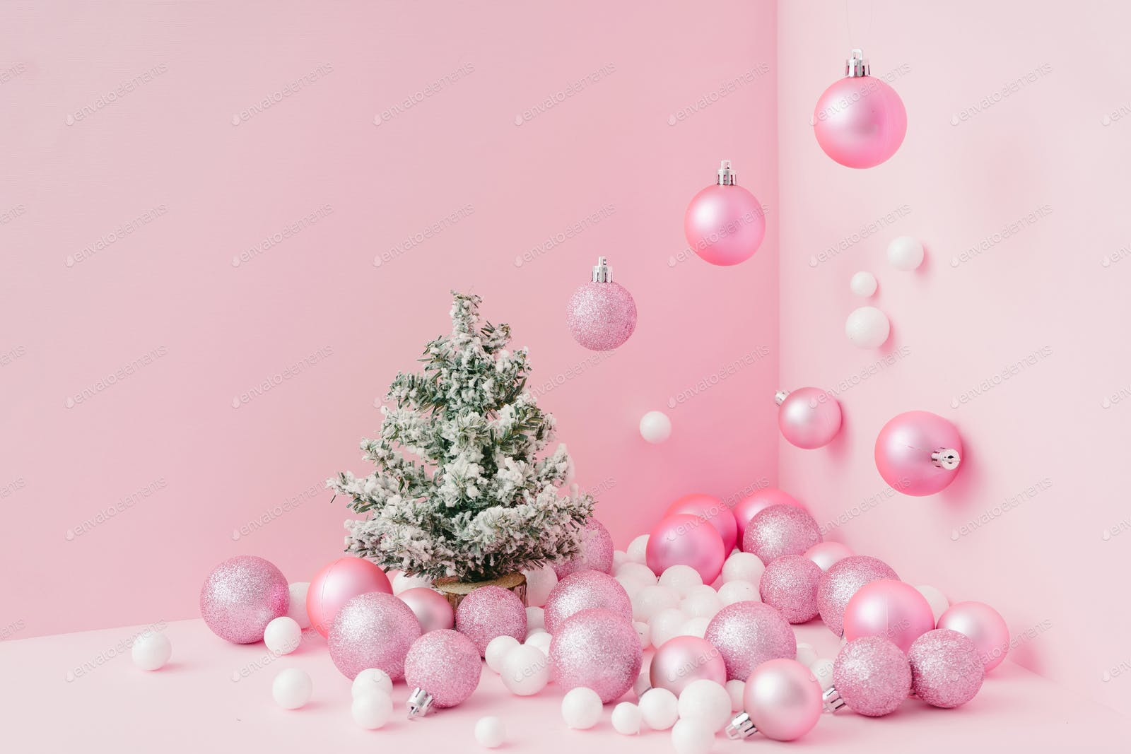 Creative Christmas design pink pastel color background with Christmas tree. New Year concept. photo by zamurovic on Envato Elements