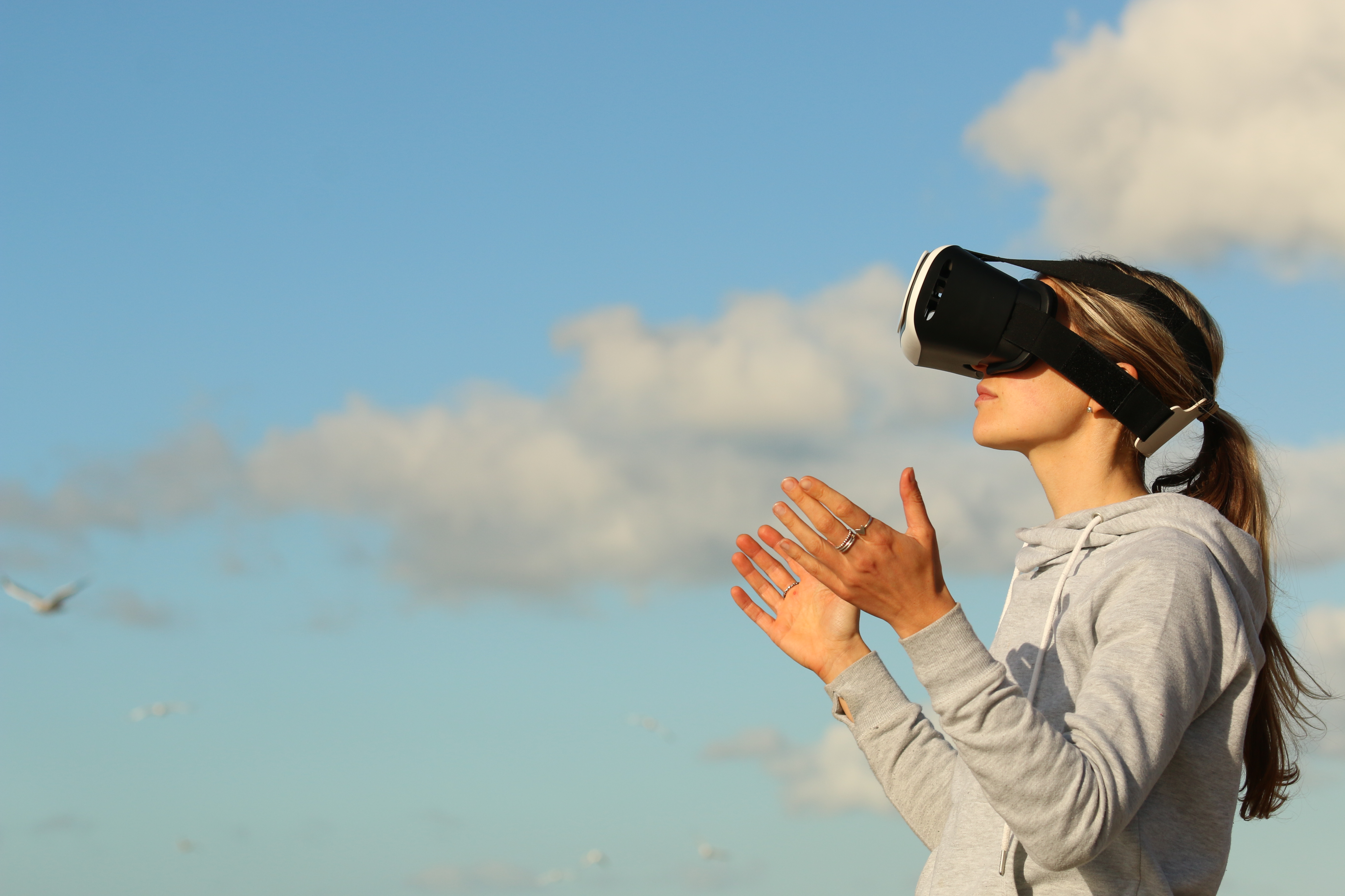 Woman Using Vr Goggles Outdoors · Free