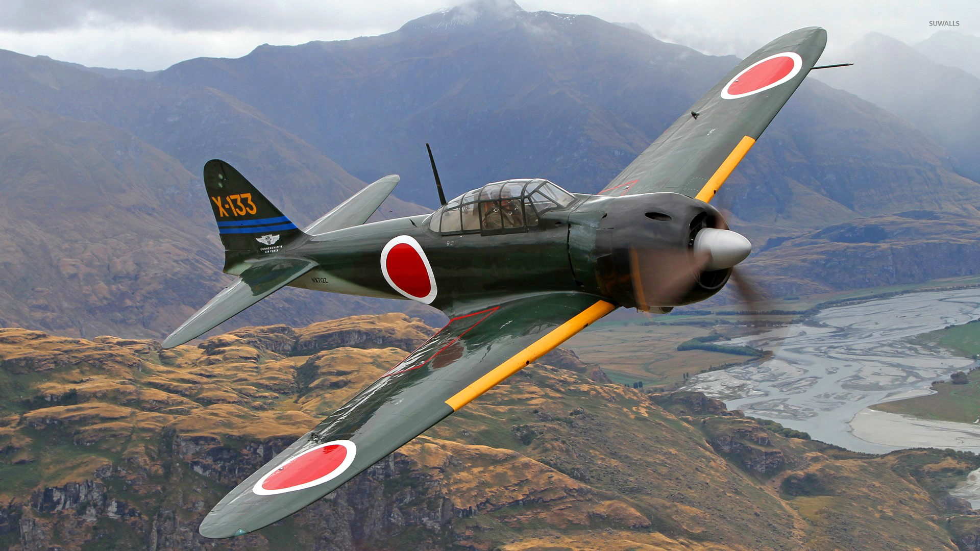 Mitsubishi A6M Zero flying above the hills wallpaper wallpaper