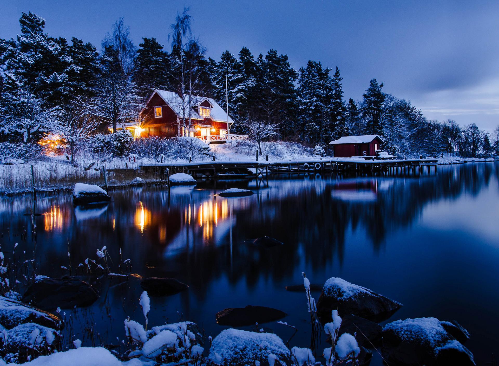 Winter holiday night at the cottage in the mountain