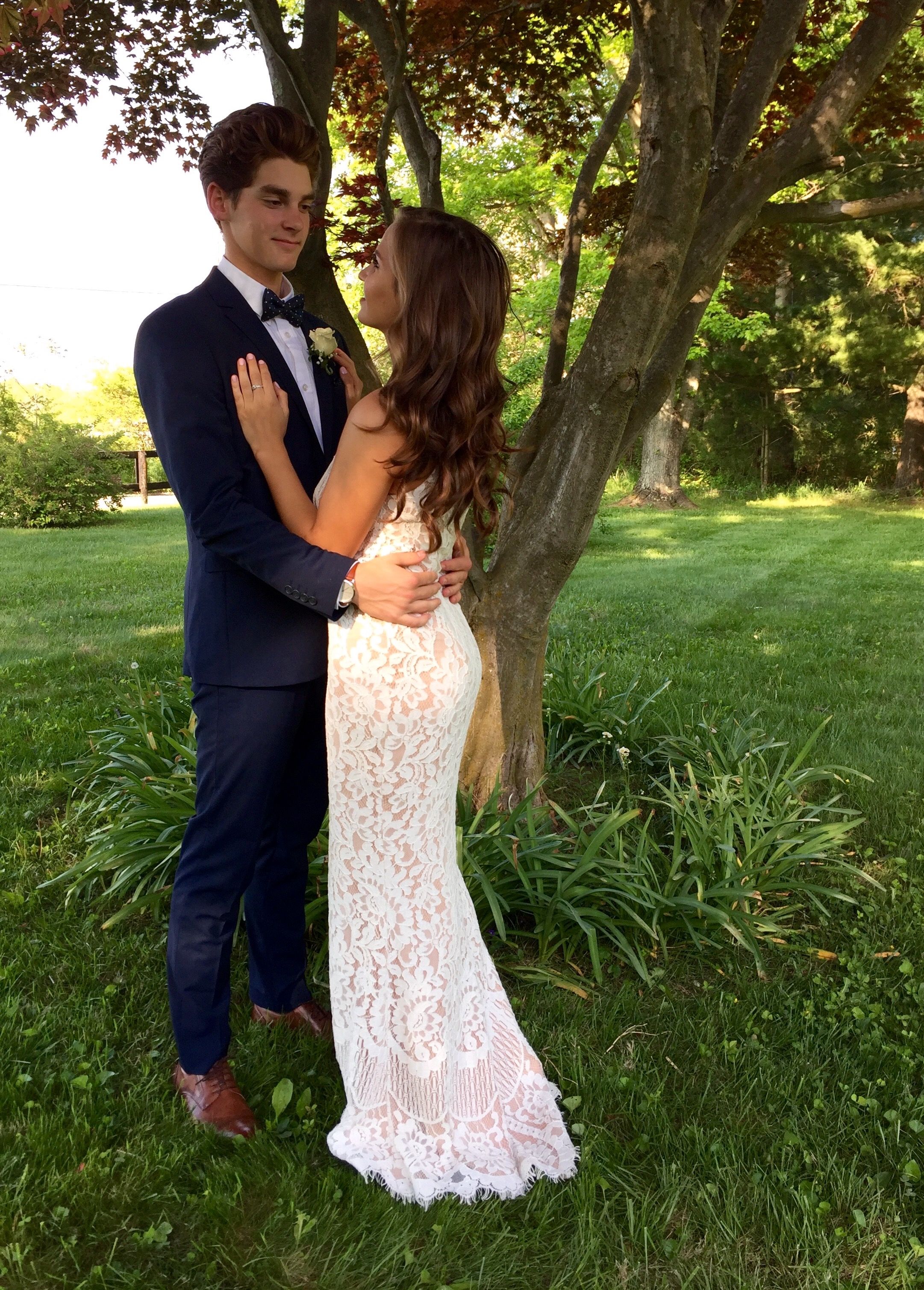 Prom couple, white dress, prom, prom picture, navy suit, summer. Prom couples, Prom couples outfits, Prom picture couples