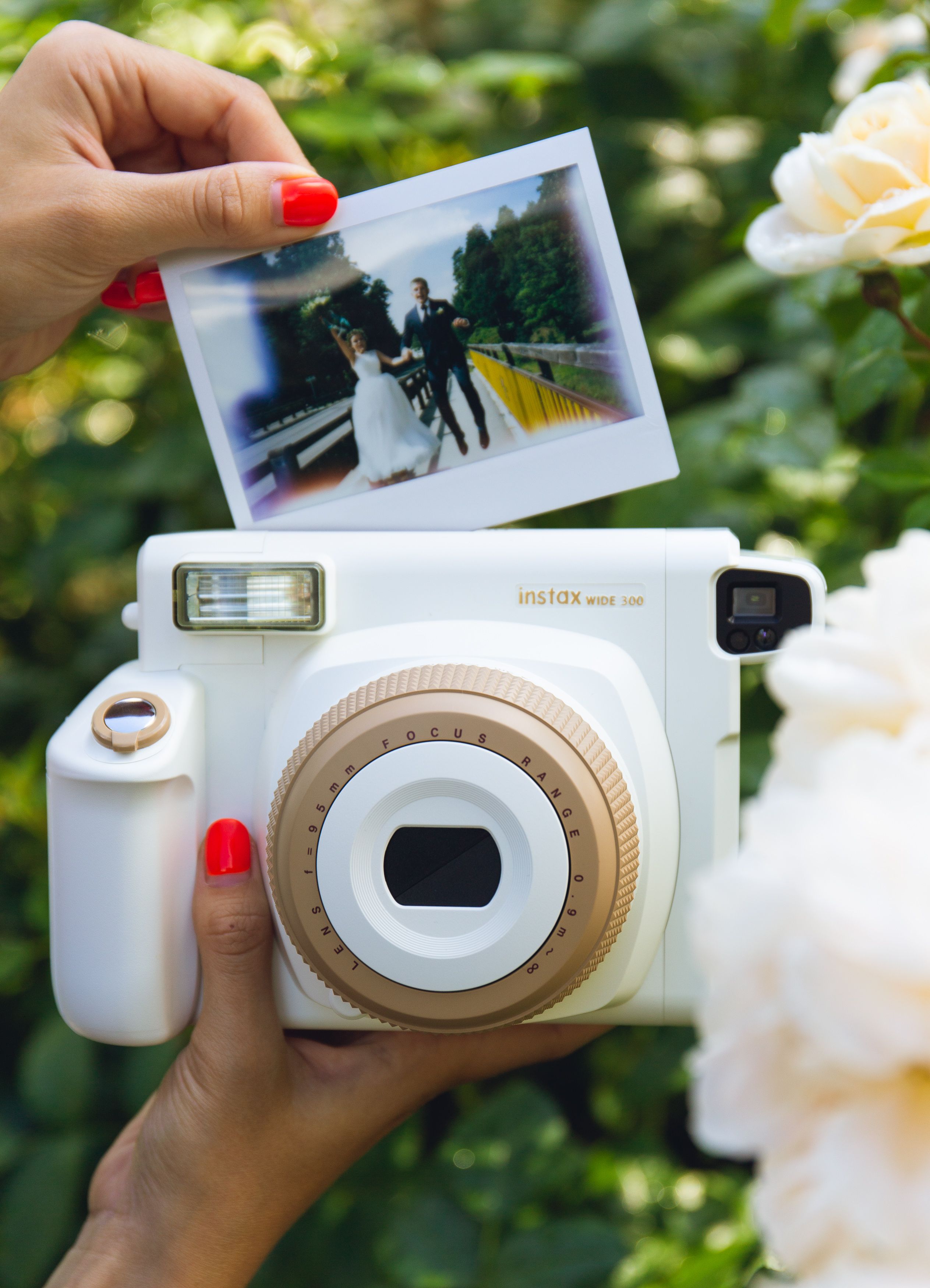 Instax Wide 300 Toffee Instant Camera. Polaroid camera white