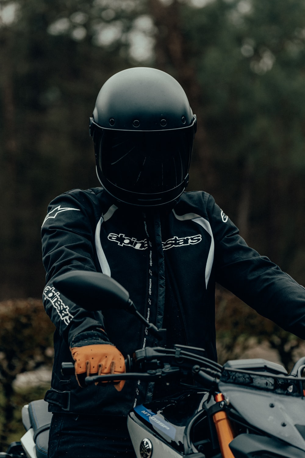 person in black helmet and black helmet photo