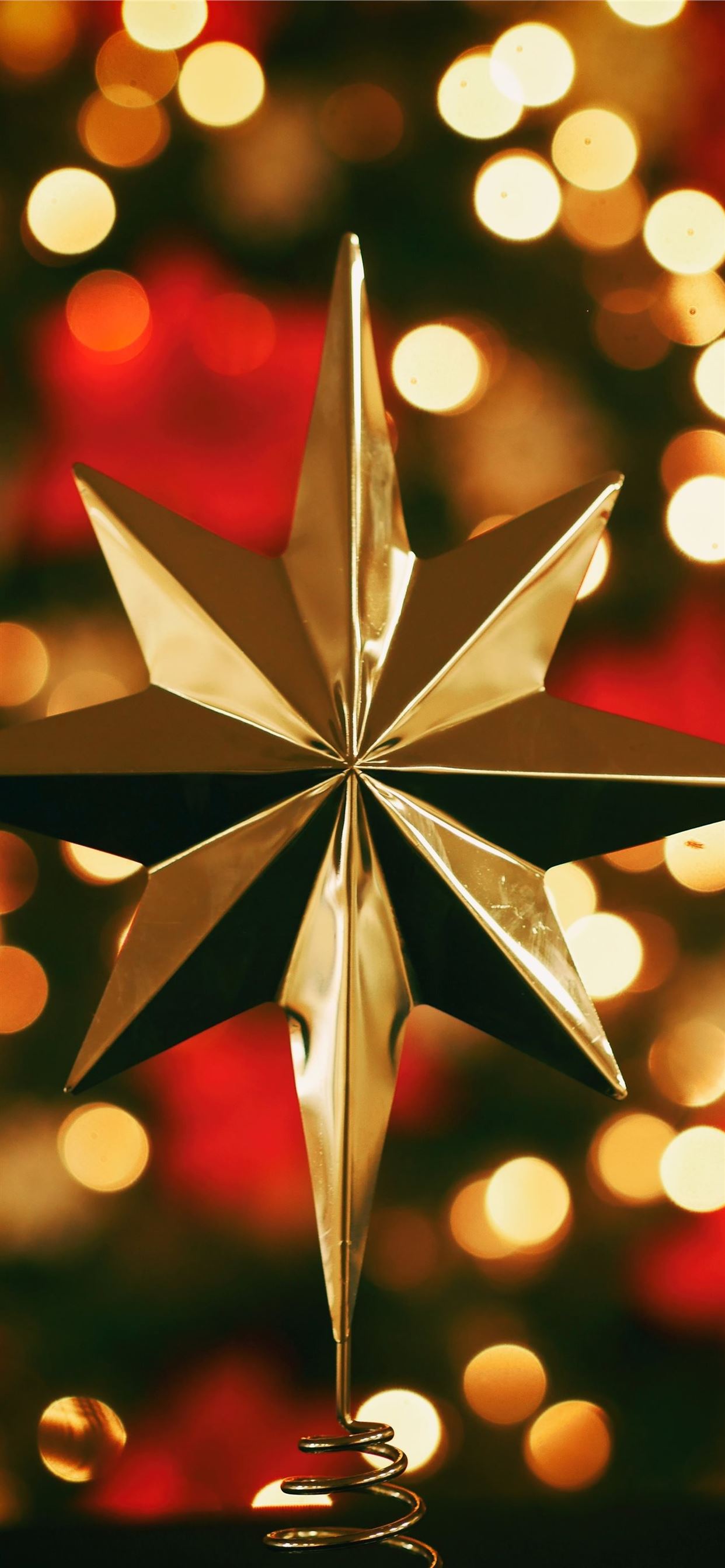 bokeh photography of gold star tree topper iPhone 11 Wallpaper Free Download