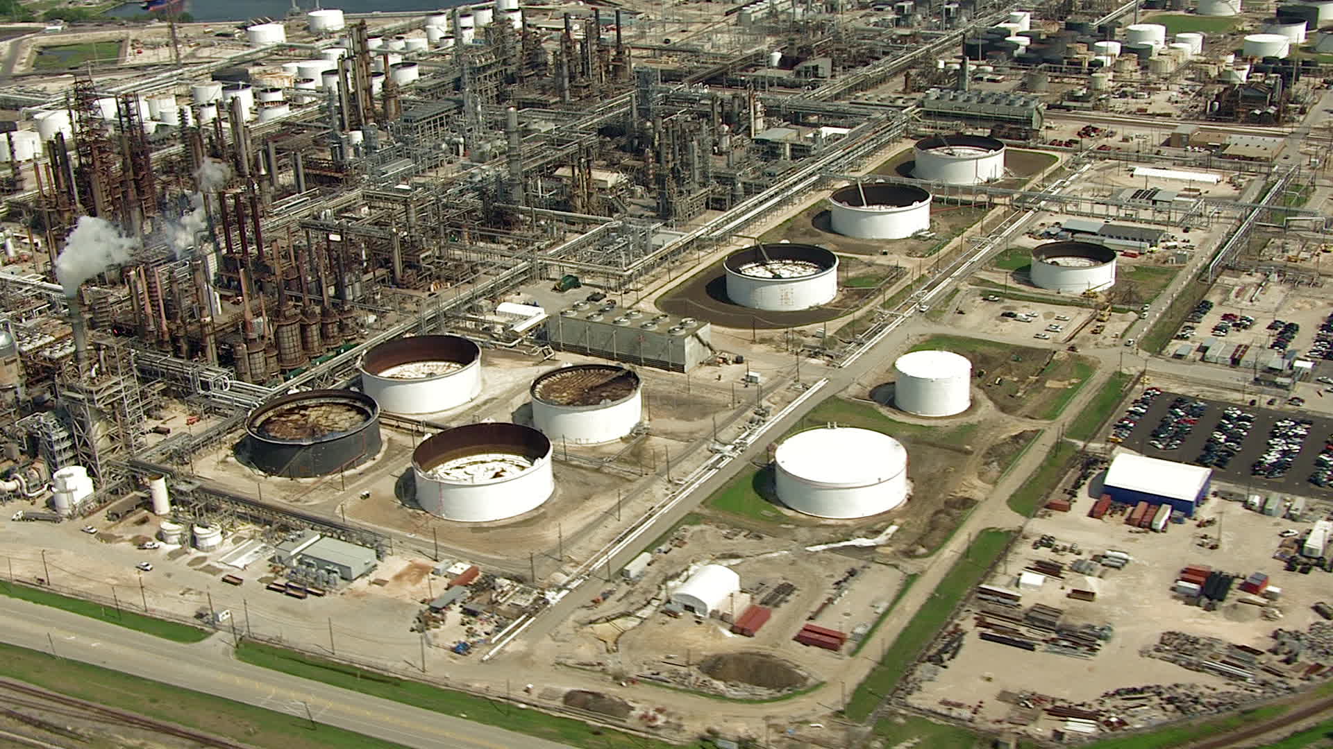 HD stock footage aerial video orbit oil refinery buildings and tanks in Harrisburg, Manchester, Texas Aerial Stock Footage AF0001_000282