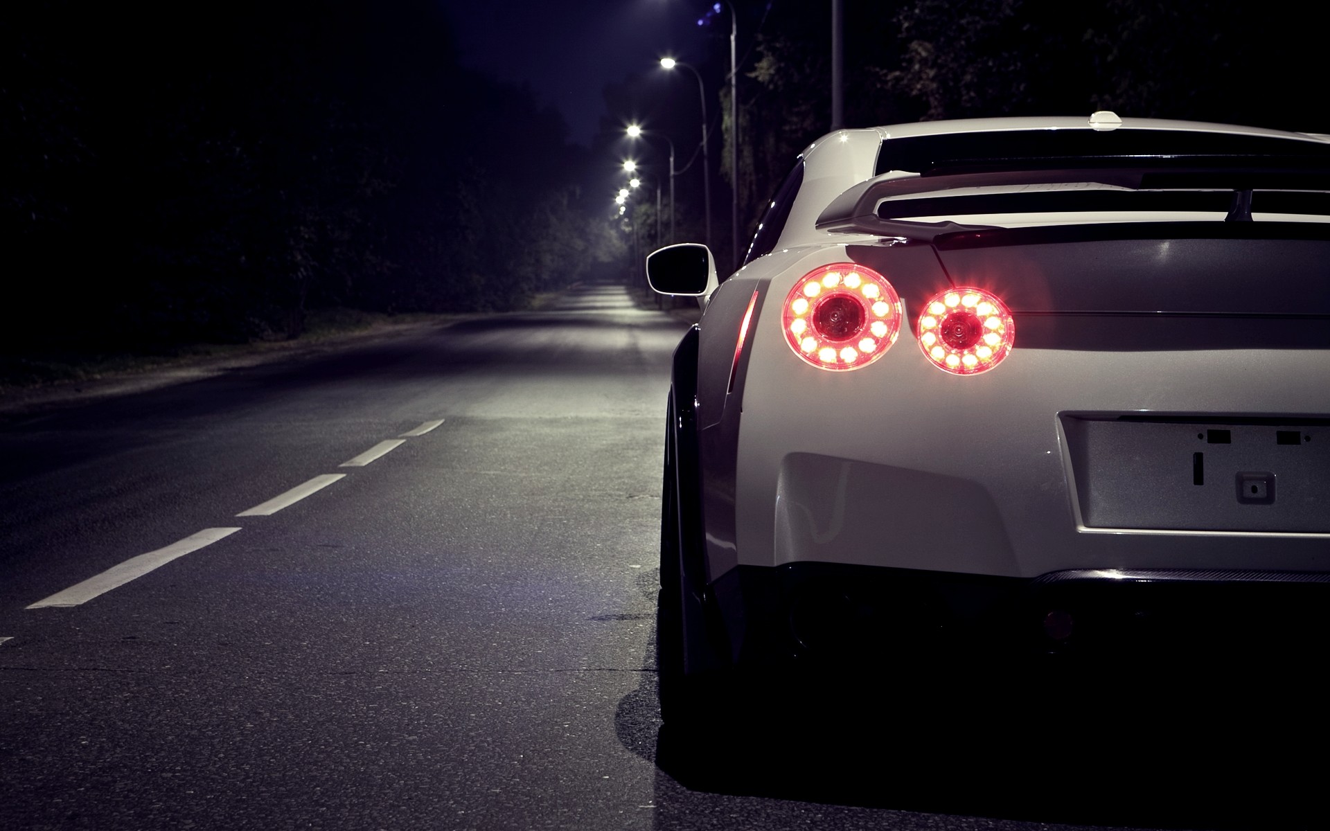 White Nissan 35 GTR at Night Rear Section wallpaper. White Nissan 35 GTR at Night Rear Section