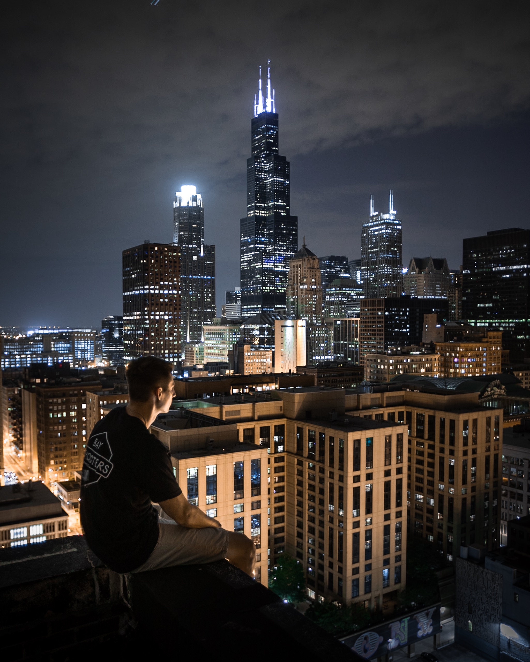 Man Sitting On Rooftop At Night · Free