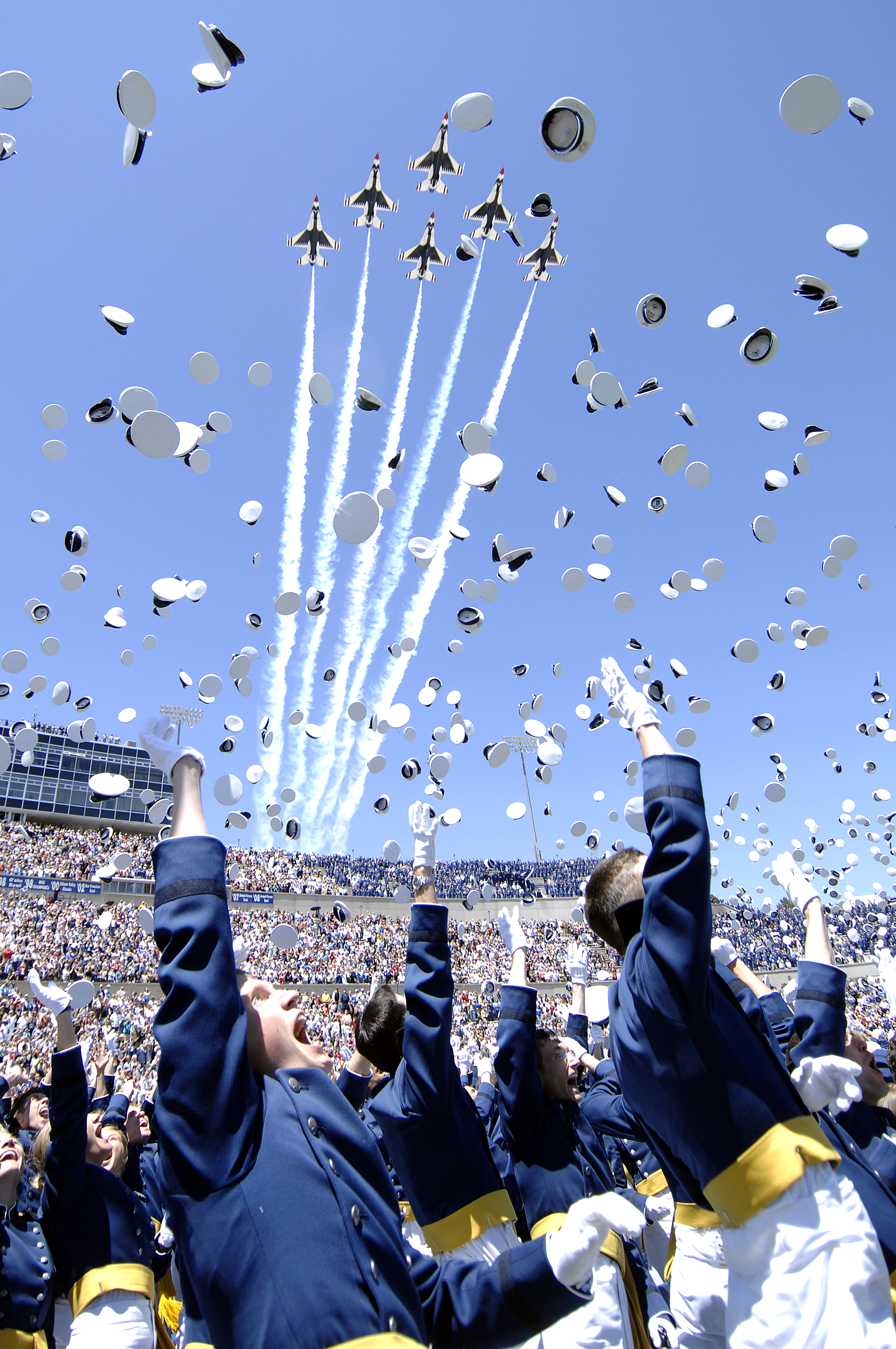 The 1,046 newly commissioned second lieutenants at the U.S. Air Force Academy commemorate their achievement by