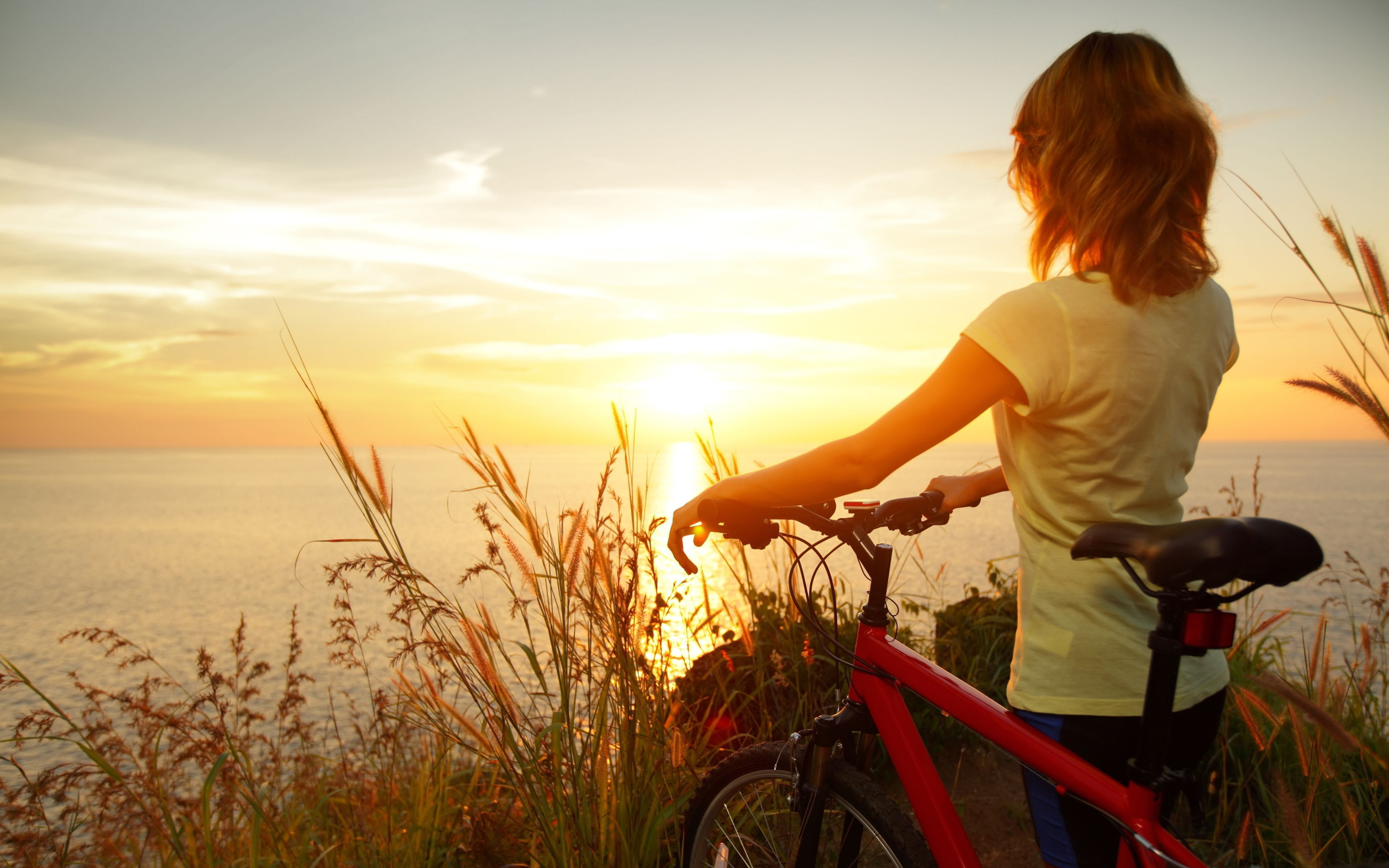 Biker girl watch sunset wallpaperx1800