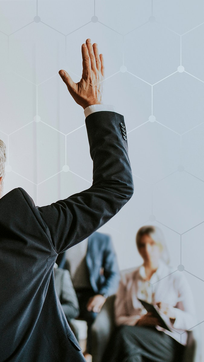 Businessman raising hand in a meeting