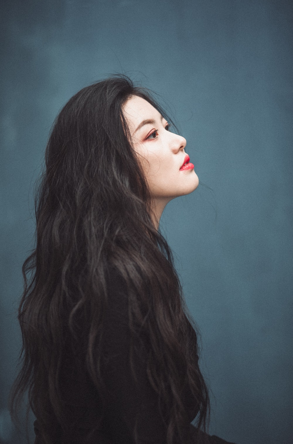 woman with red lipstick and black hair photo