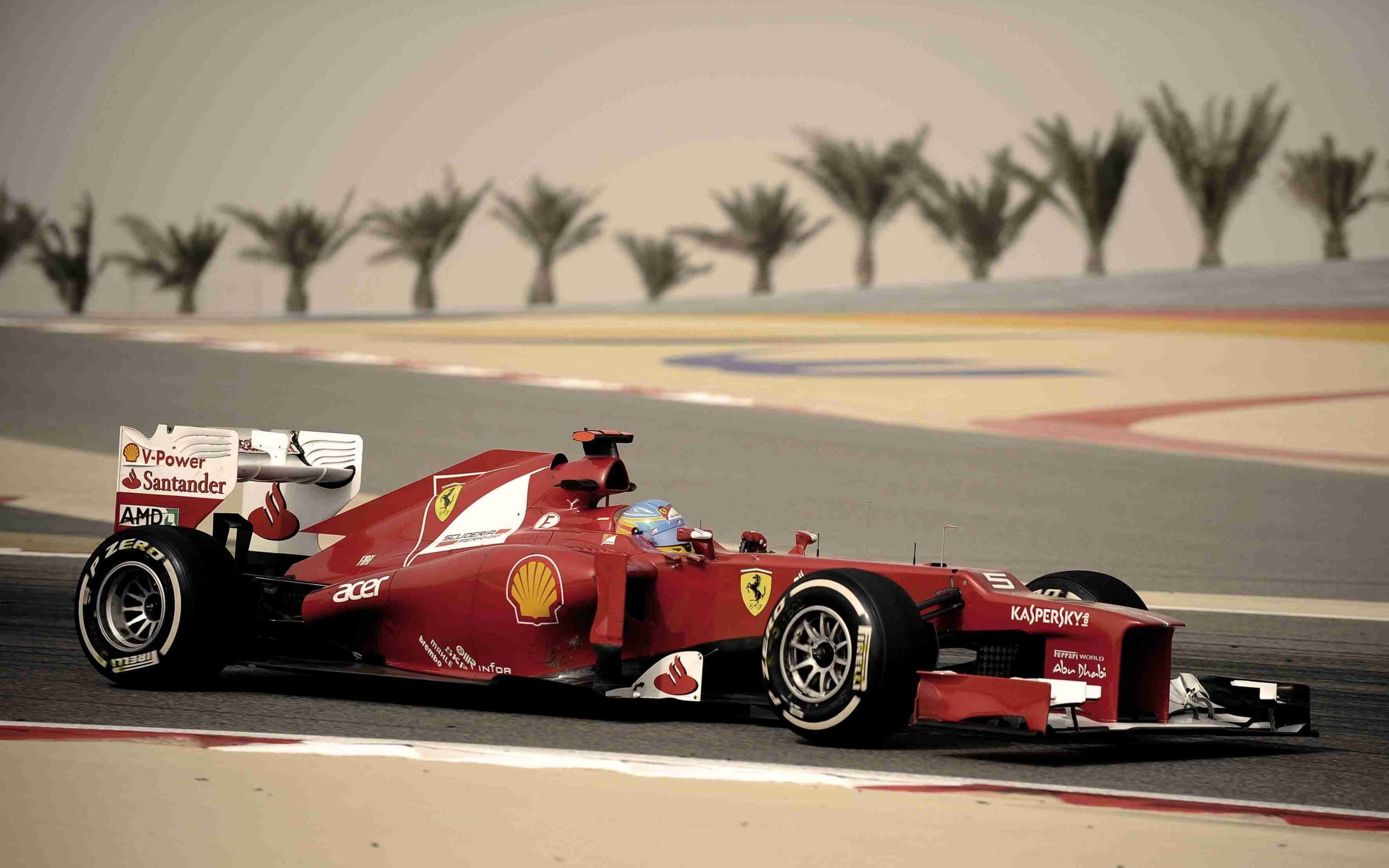 2560x Red Ferrari F1 Race Car On Race Track During F1 Car
