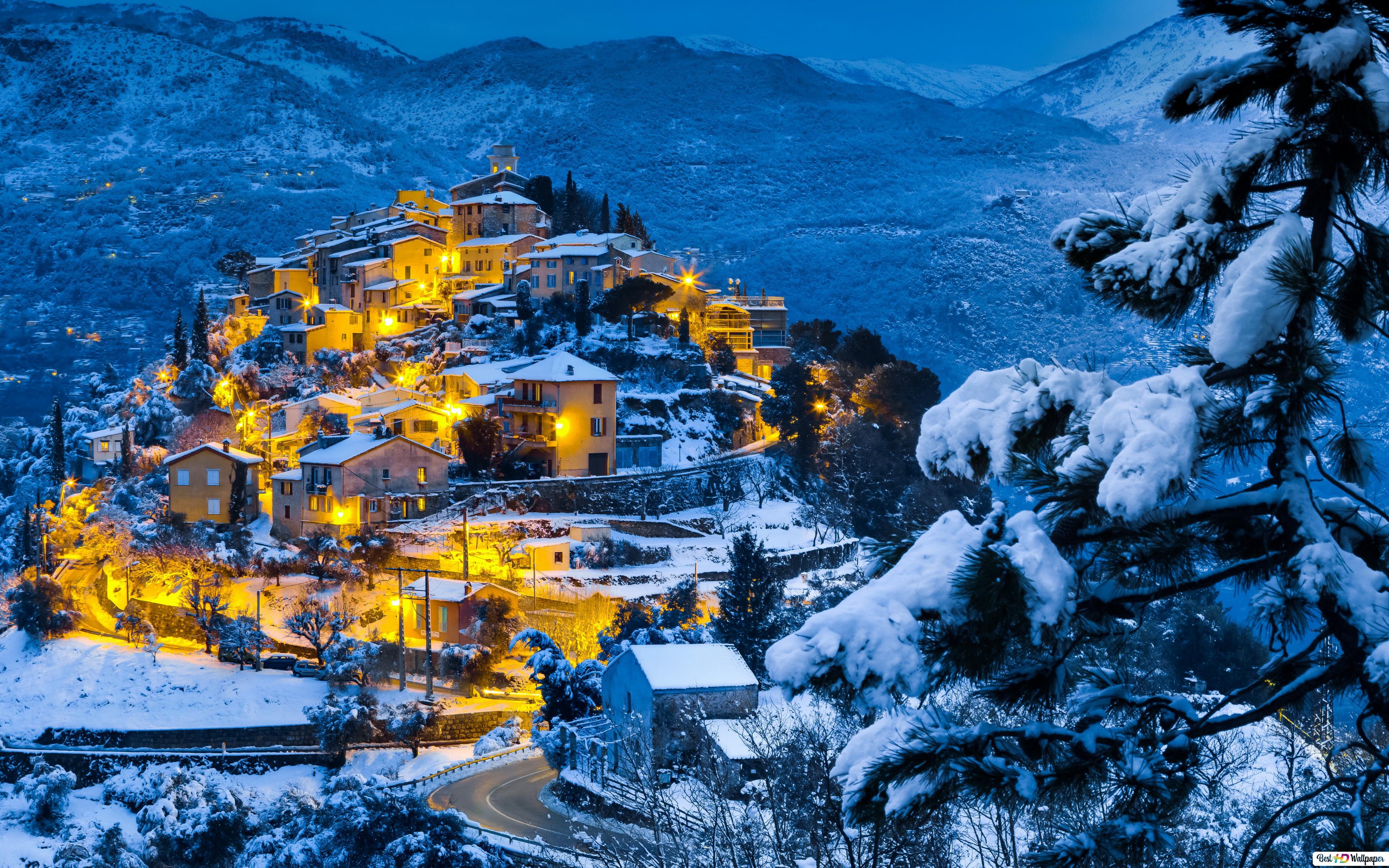 Cozy village on a snowy hill 4K wallpaper download