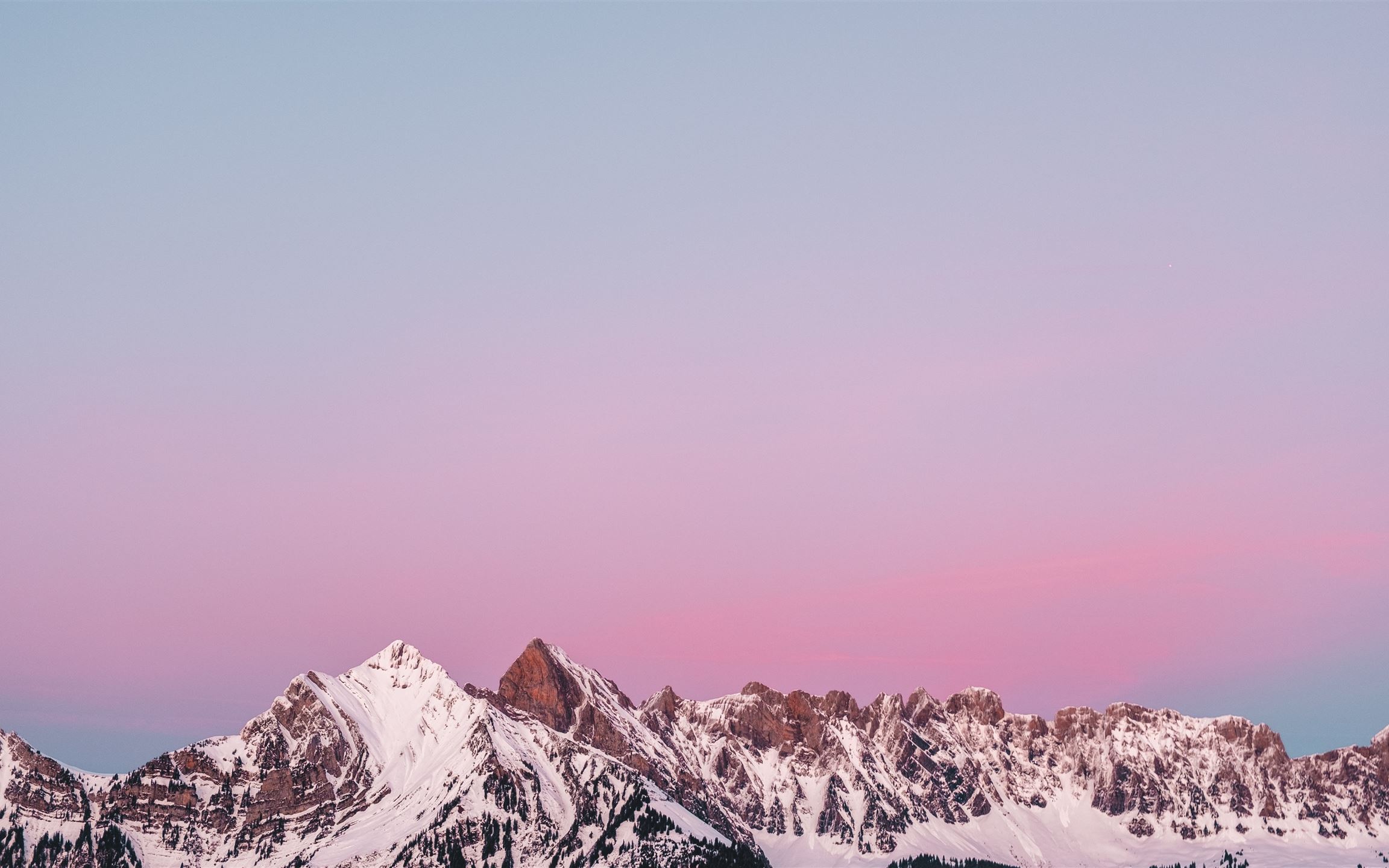 Lovely sunset behind a snowy mountain in Flums Swi Mac Wallpaper Download