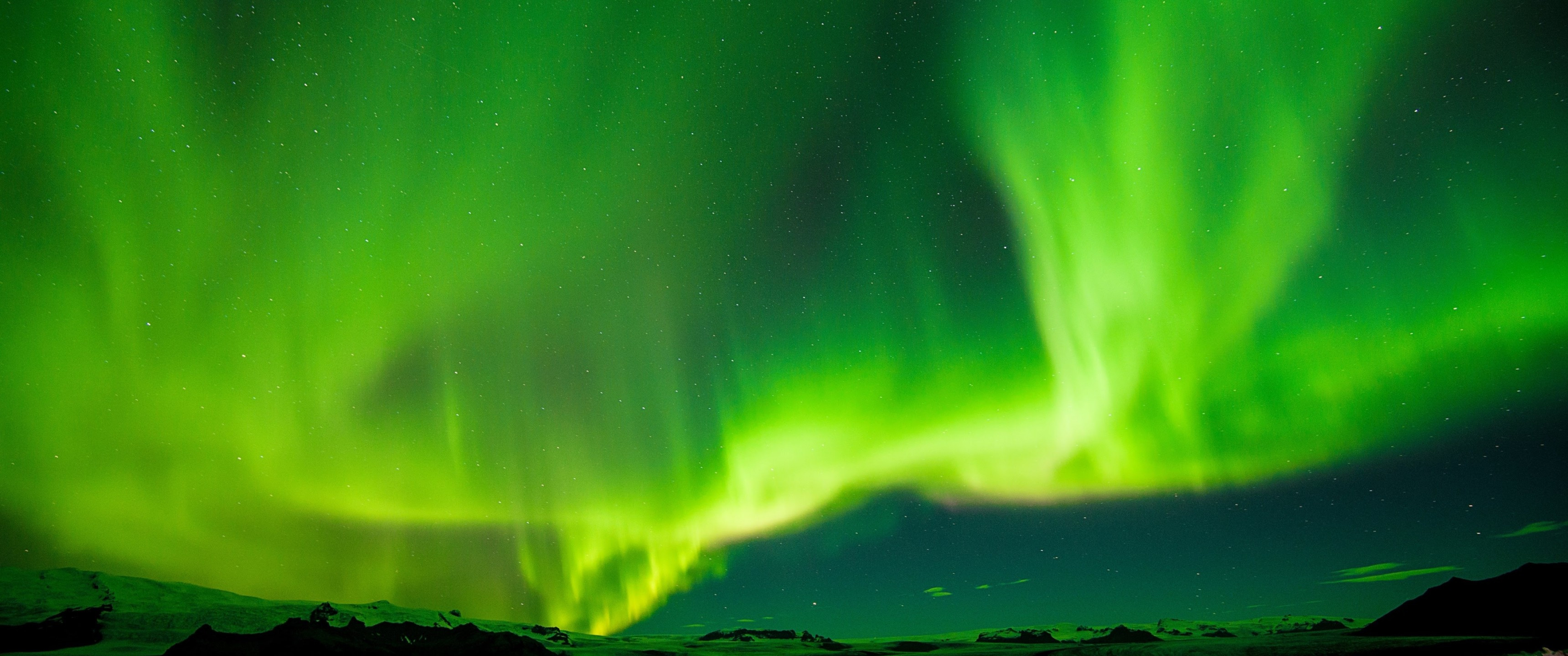 Download 3440x1440 Iceland, Aurora Borealis, Green, Stars Wallpaper