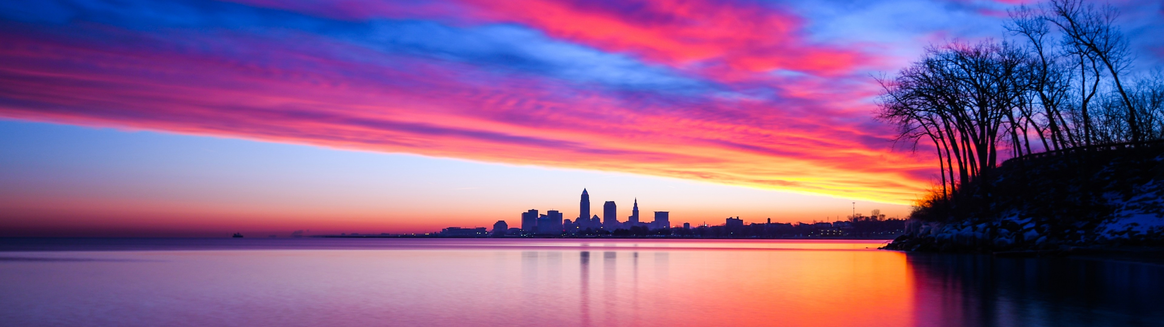 Download 3840x1080 United States, Cleveland, Ohio, Sunset, Clouds, Cityscape, Water, Twilight Wallpaper