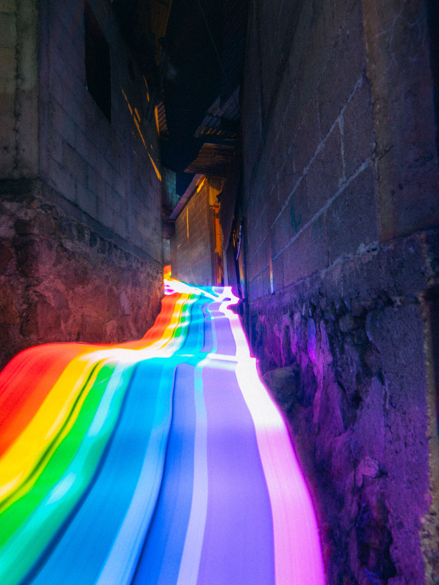 Vivid Rainbow Roads Trace Illuminated Pathways Across Forests and Beaches