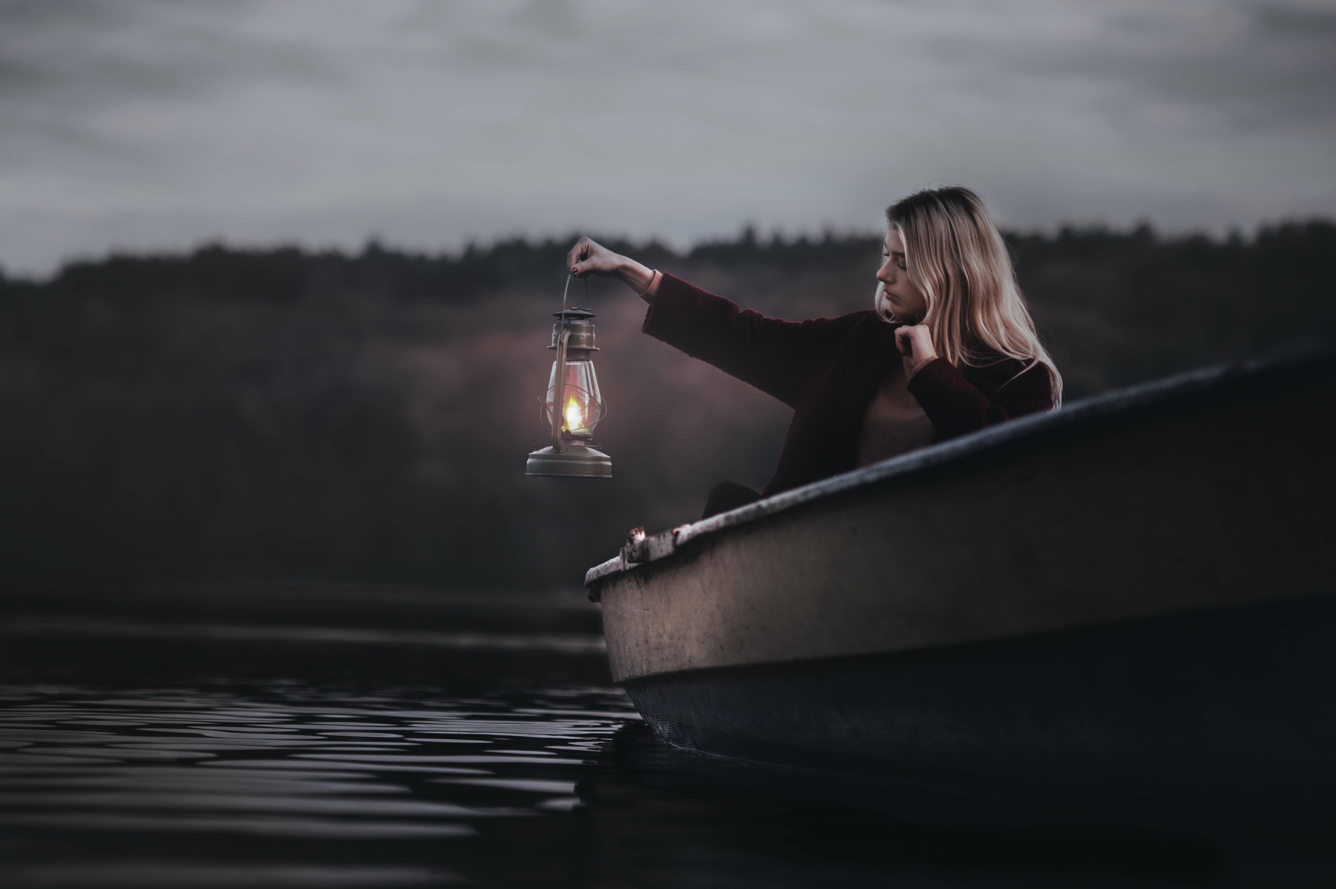Woman On A Boat Holding Gas Lantern · Free