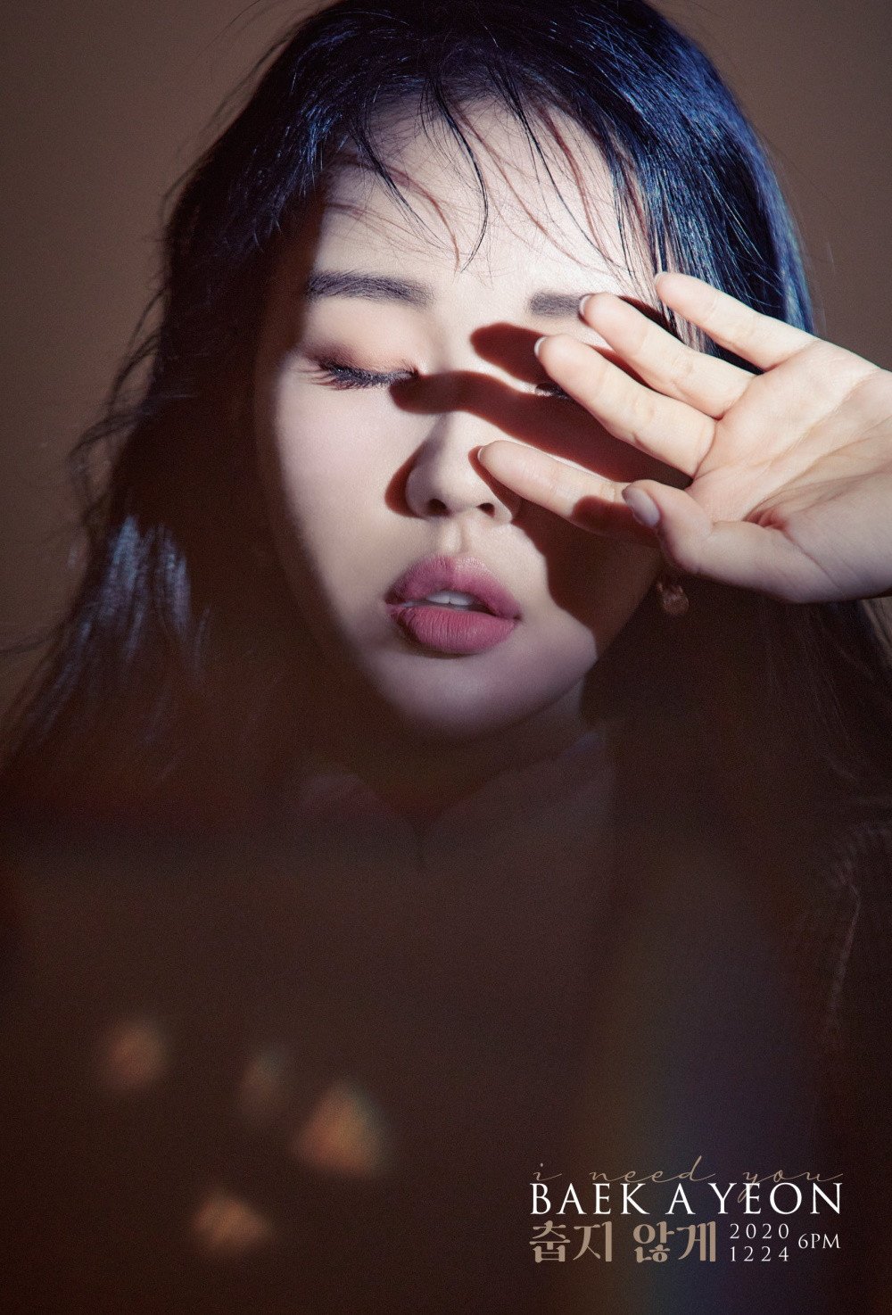 Baek Ah Yeon covers her eyes in 'I Need You' concept photo