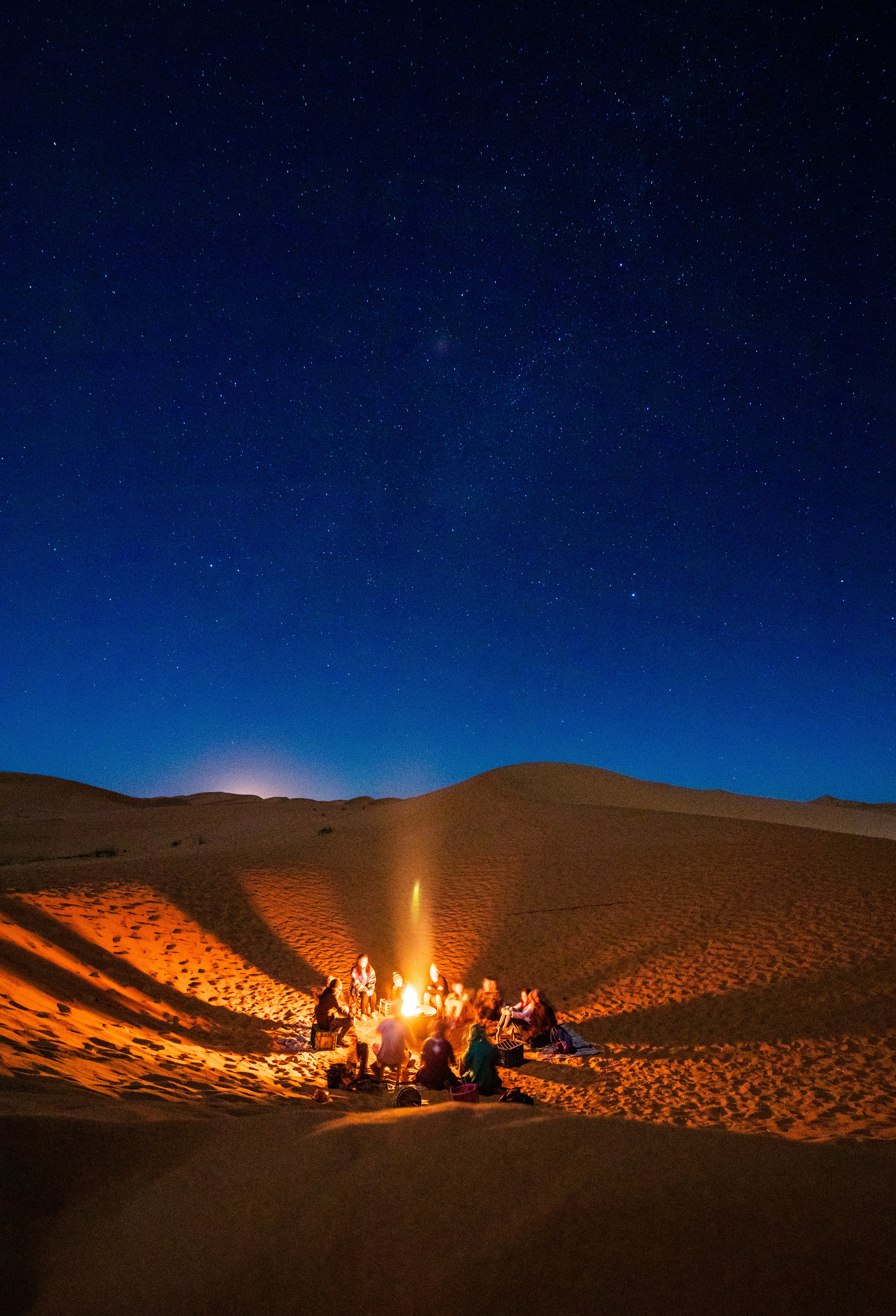 People Sitting in Front of Bonfire in Desert during Nighttime · Free