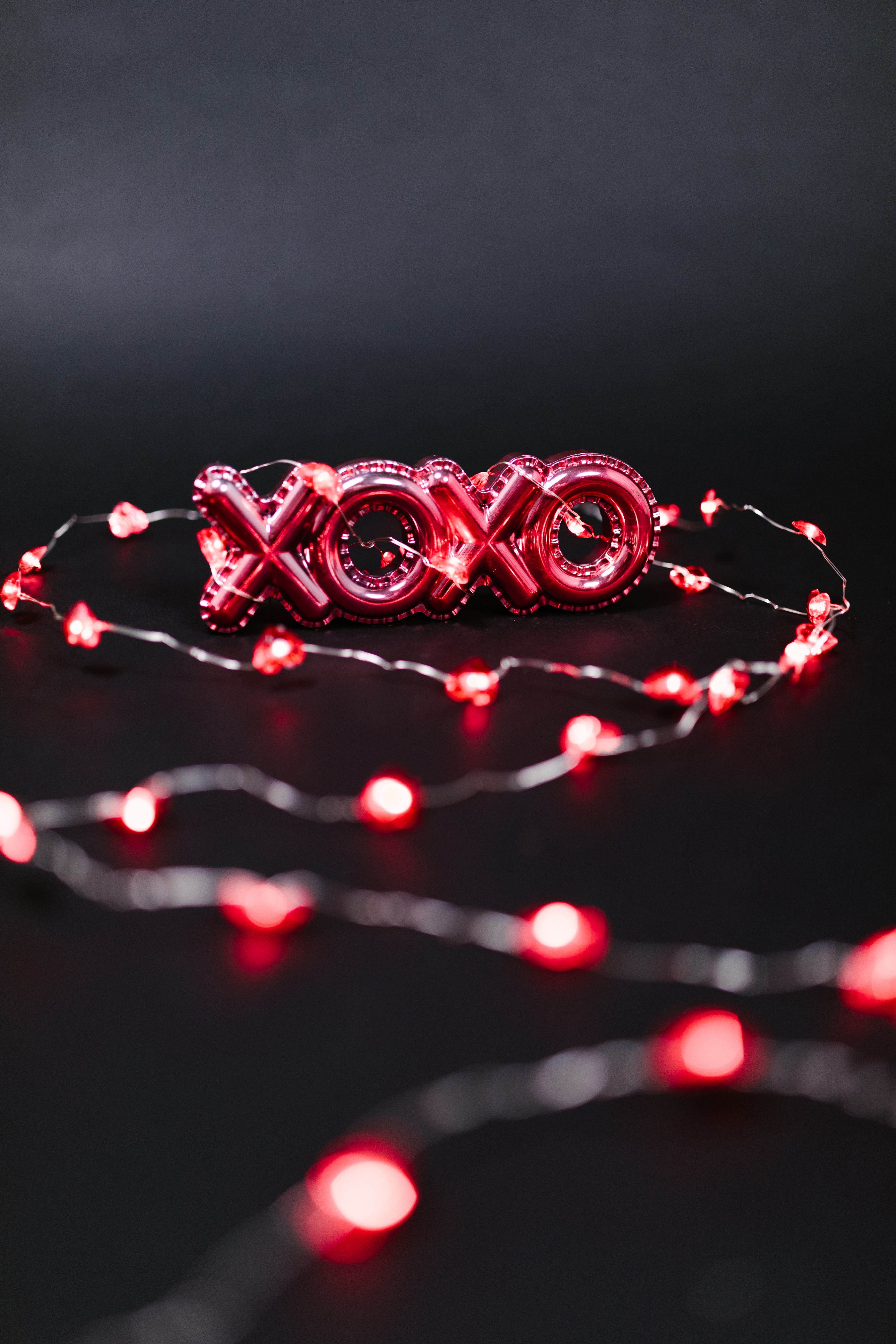 Red Xoxo and String Lights on Black Background · Free