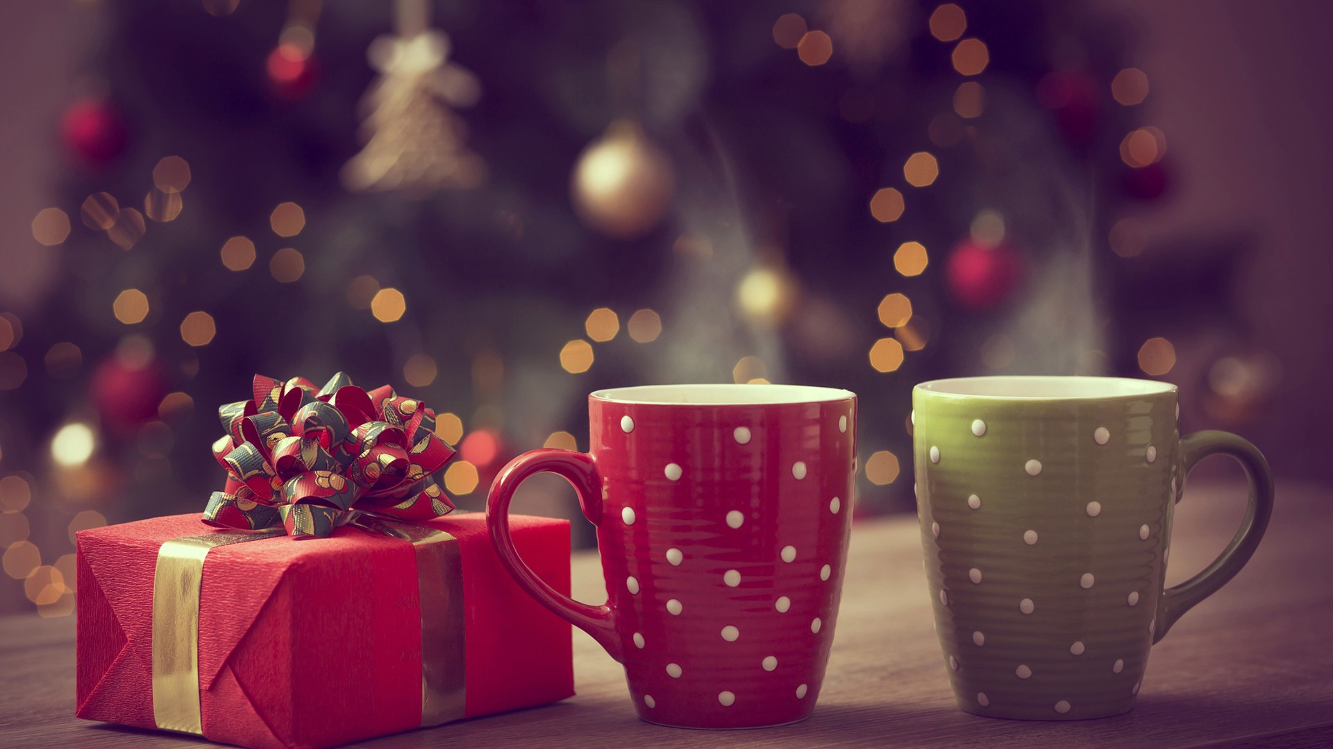 Gift And Cups On Table With Shallow Background Of Christmas Ornaments And Lights HD Christmas Wallpaper Desktop Wallpaper