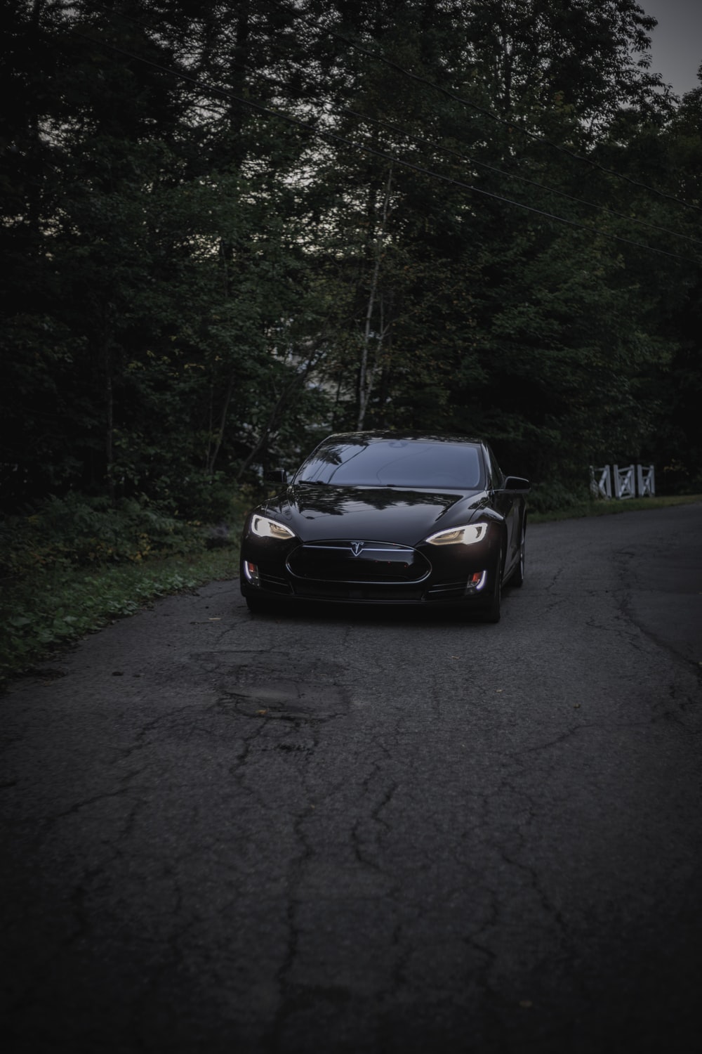 black Tesla Model S at nighttime photo