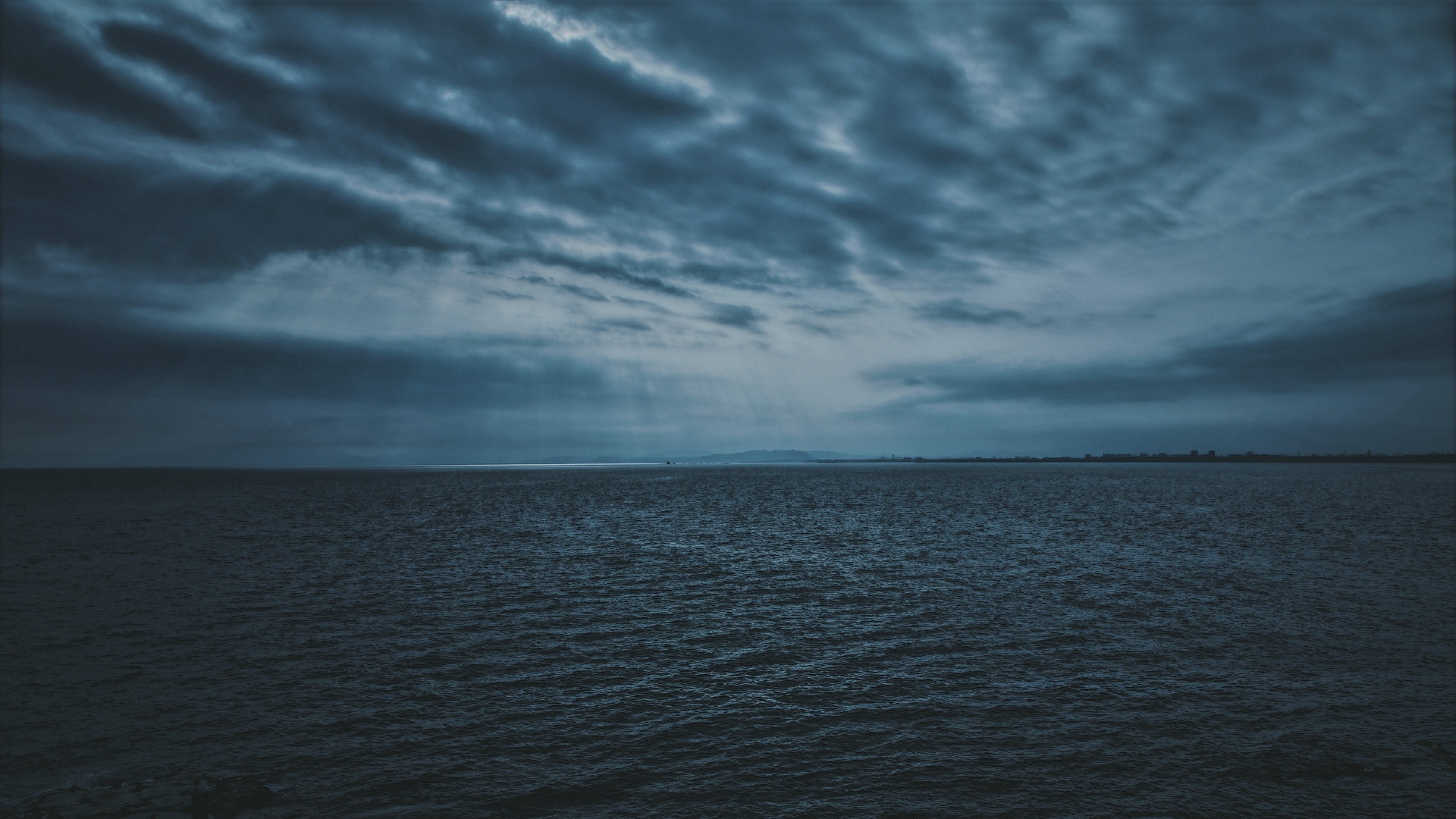 Dark clouds over the sea HD Wallpaper 4K Ultra HD