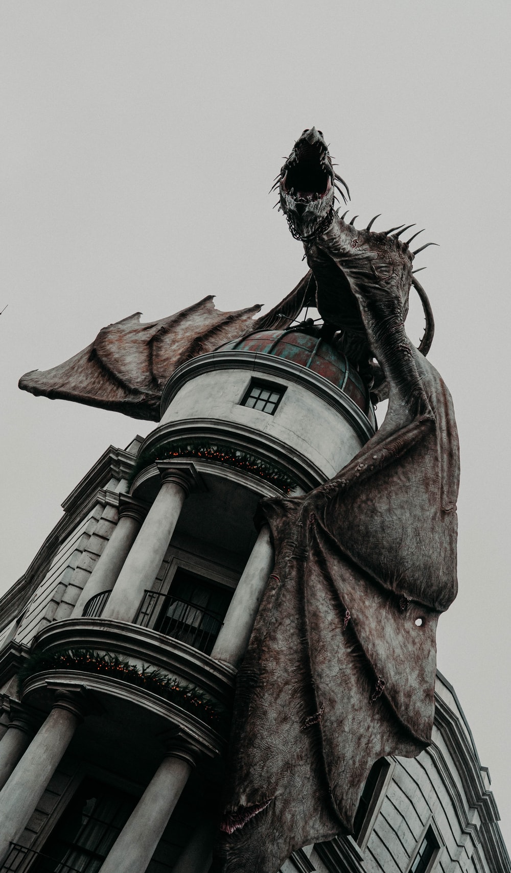 shallow focus photo of dragon on gray building photo