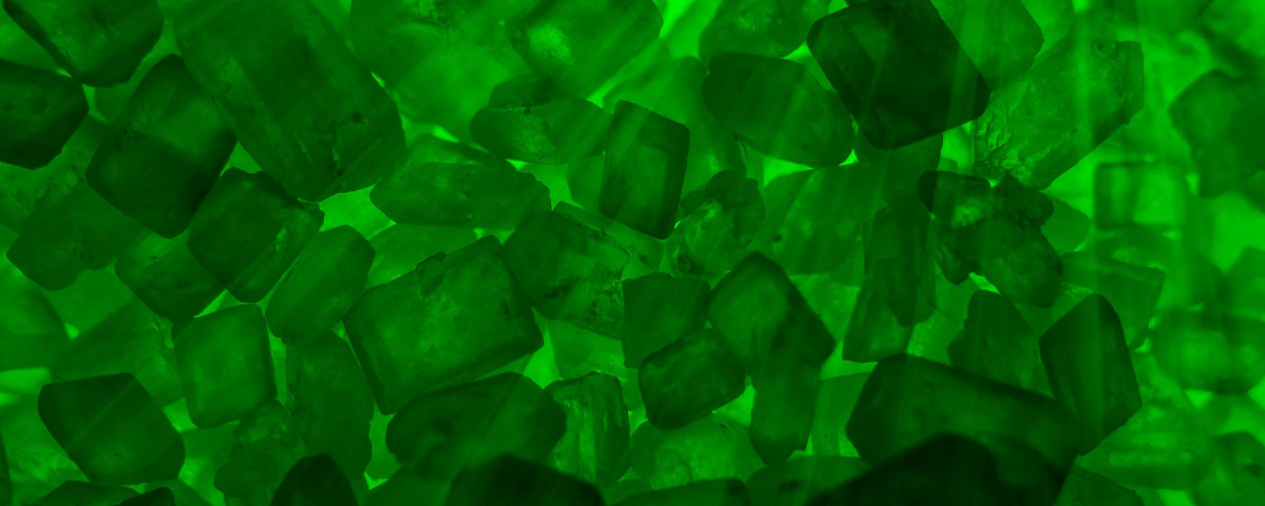 Download wallpaper 2560x1024 stones, crystals, rays, green ultrawide monitor HD background