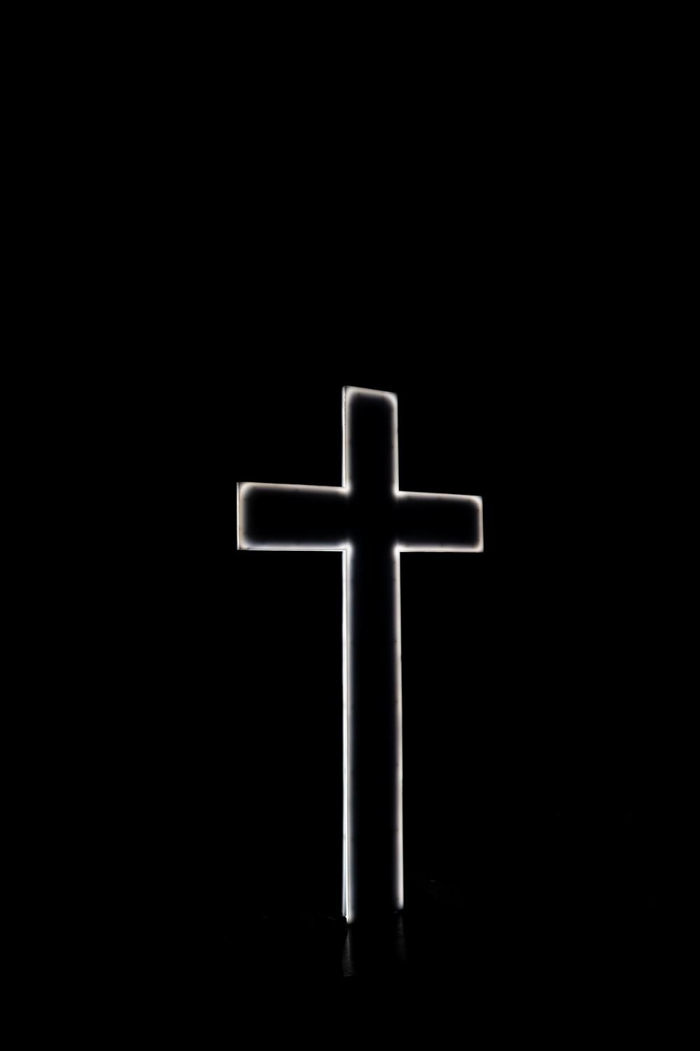 white cross with black background photo