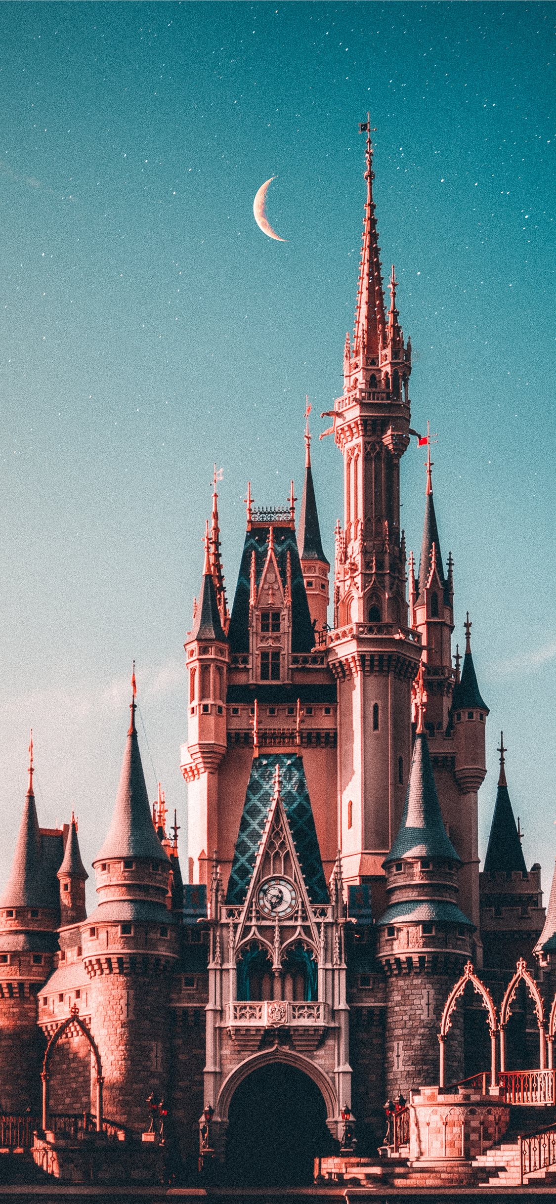 blue and beige Disneyland castle iPhone X Wallpaper Free Download