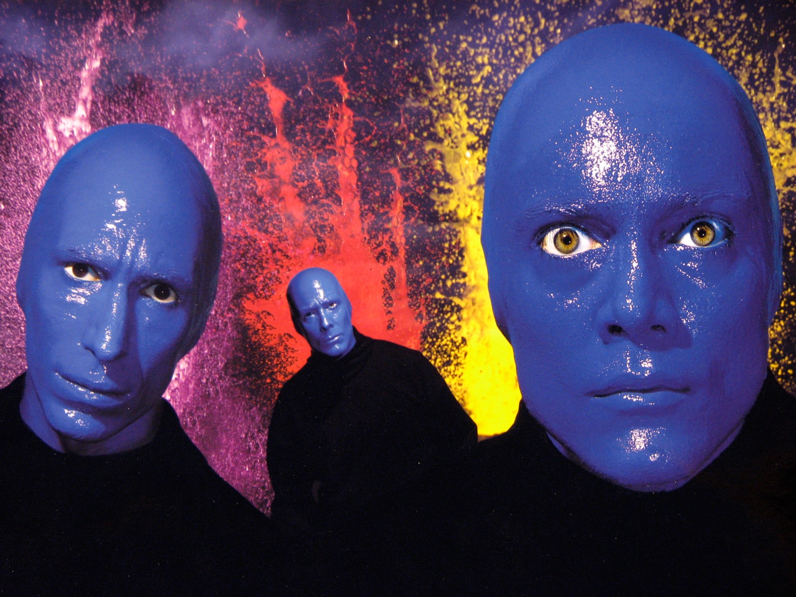 Blue Man Group History Blue Man Group pose for a promotional shot advertising