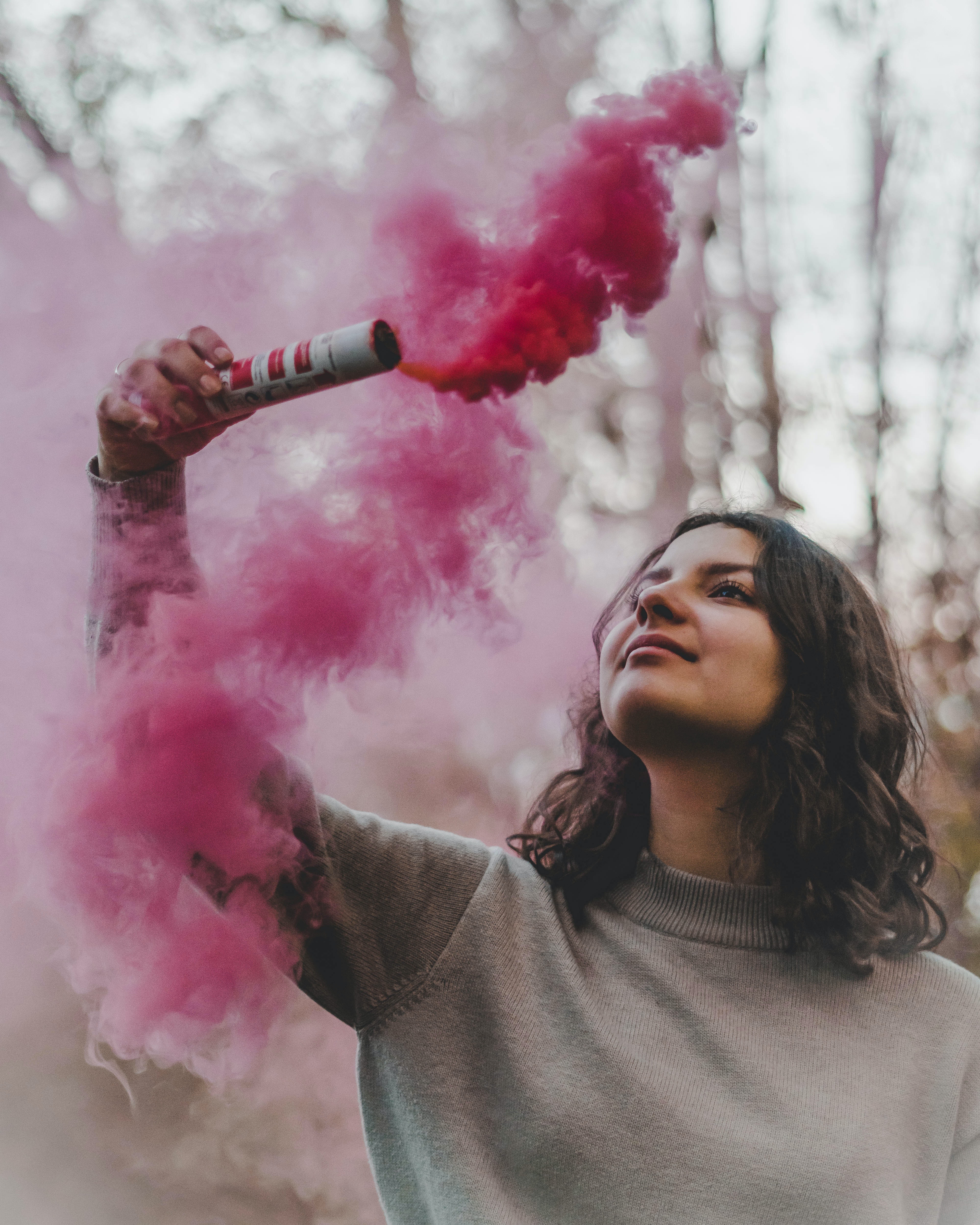 Woman Holding Pink Smoke · Free