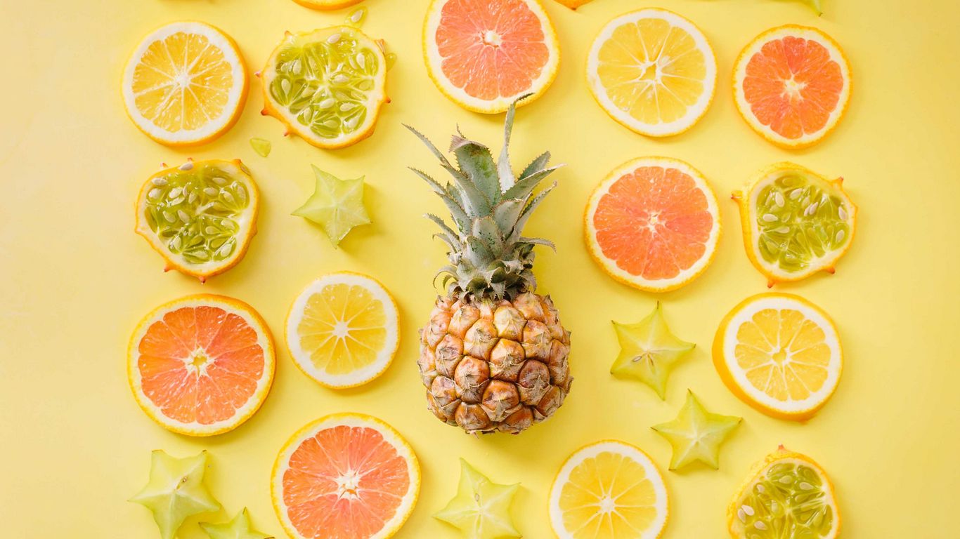 Download wallpaper 1366x768 fruit, citrus, pineapple, yellow, lemon, orange tablet, laptop HD background