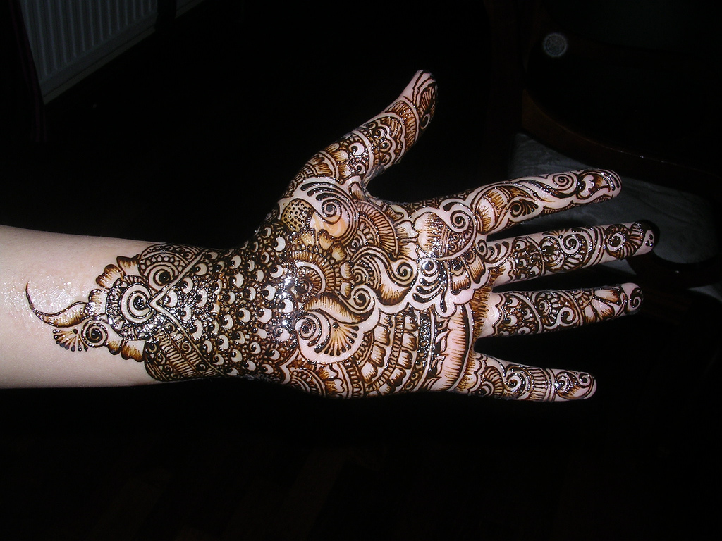 Download wallpaper 2560x1440 mehndi henna candle hands palms widescreen  169 hd background
