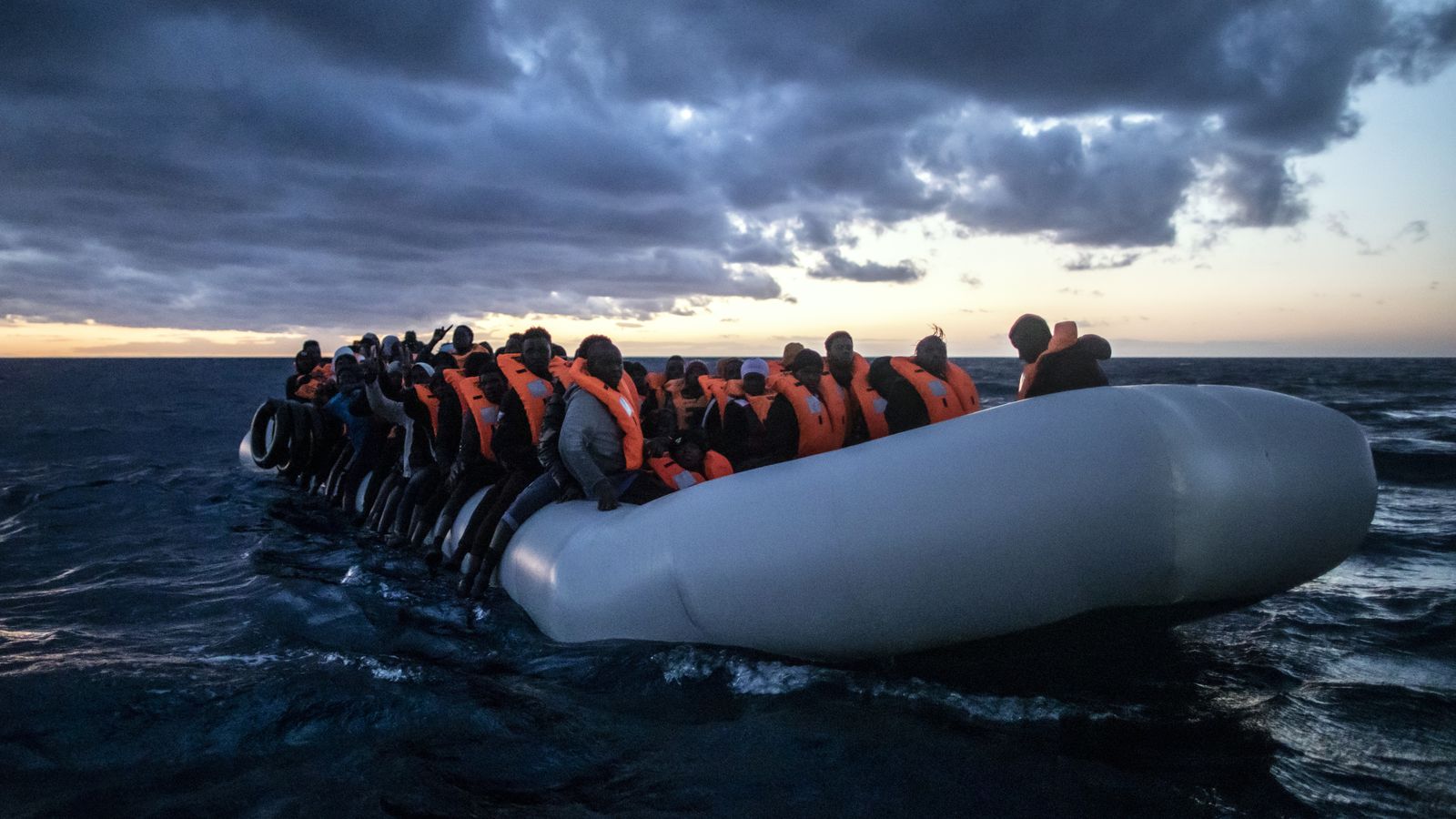 Photos show migrants evading Libyan coast guard to reach Europe