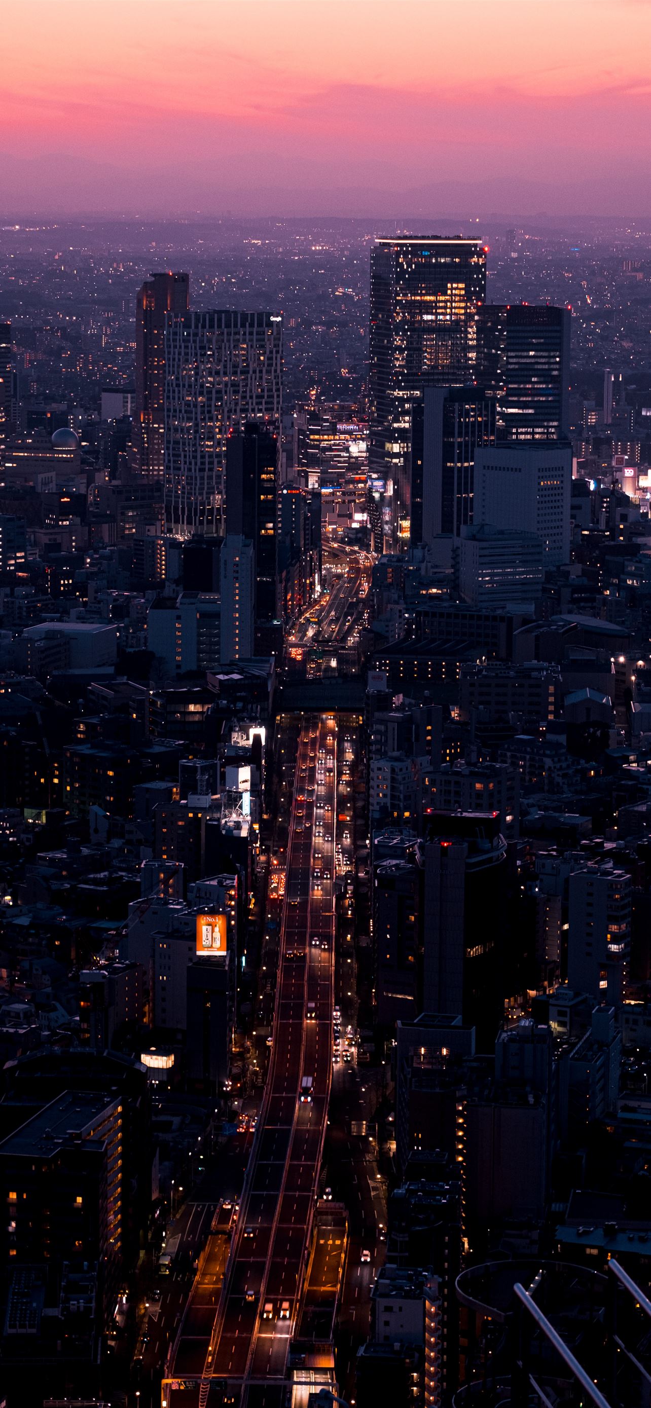 aerial view of city buildings during night time iPhone 12 Wallpaper Free Download