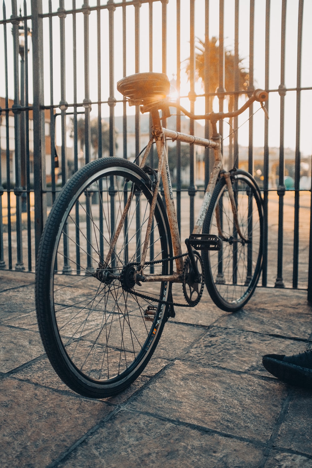 black bicycle parked on sidewalk during daytime photo