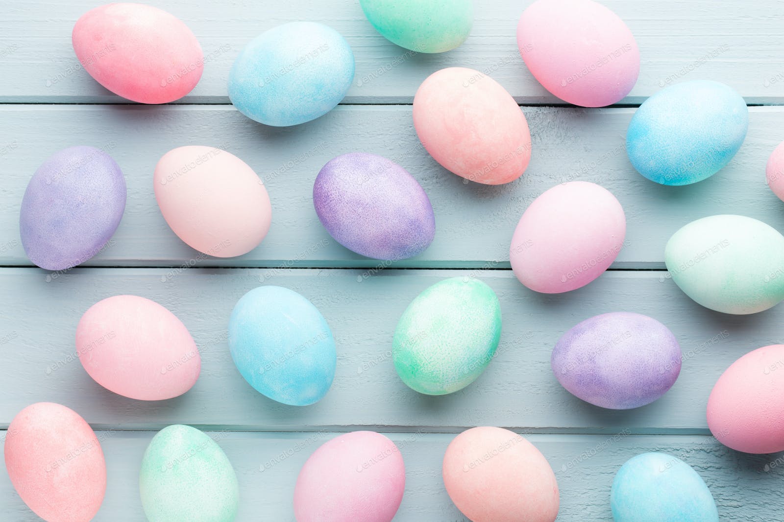 Pastel Easter eggs background. Spring greating card. photo by GitaKulinica on Envato Elements